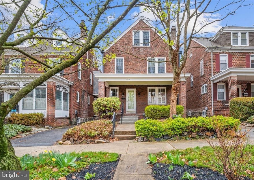 Welcome to this stunning and charming home located on one of Wilmington's premier residential boulevards. This stately colonial home offers 5 bedrooms and 2.1 bathrooms spread across 3 levels. Step onto the quaint covered front porch to find classic hardwood floors and a formal Living Room with brick fireplace and french doors leading to the large Dining Room.  The light & bright, top-of-the-line gourmet Kitchen (completed in 2022 for approx $75k) features quartz countertops, custom white 42" cabinets with lighting, stainless steel appliances including a Thermador oven and dishwasher, built-in microwave, 5 Burner stove with retracting exhaust vent, tile backsplash, breakfast bar plus a convenient workspace off of the Kitchen with a pretty bay window. This floor is completed by a convenient half bath nearby. Going up the hardwood stairs with classic handrails, you will find 3 bedrooms including the spacious owner's suite with a large walk-in closet and private balcony to enjoy the outdoors. The 2nd floor also has a full hall bath and two front bedrooms- one with a built-in bookcase (great at home office). The third floor boasts two huge bedrooms and a third full bath. The unfinished, walk-out lower level has the washer/dryer and plenty of storage space. Additional features include 2 newer mini-split units for cooling and a brand new furnace installed in 2026. Outside, enjoy the private rear yard with fencing, paver patio and lovely hardscape for outdoor entertaining. The shared driveway and detached garage make parking convenient.  All this plus conveniently located to downtown, vibrant Wilmington with Christiana Hospital, financial and business hubs, dining, entertainment venues and nearby I95.  Don't miss the opportunity to own this beautifully updated home with modern amenities and classic charm.