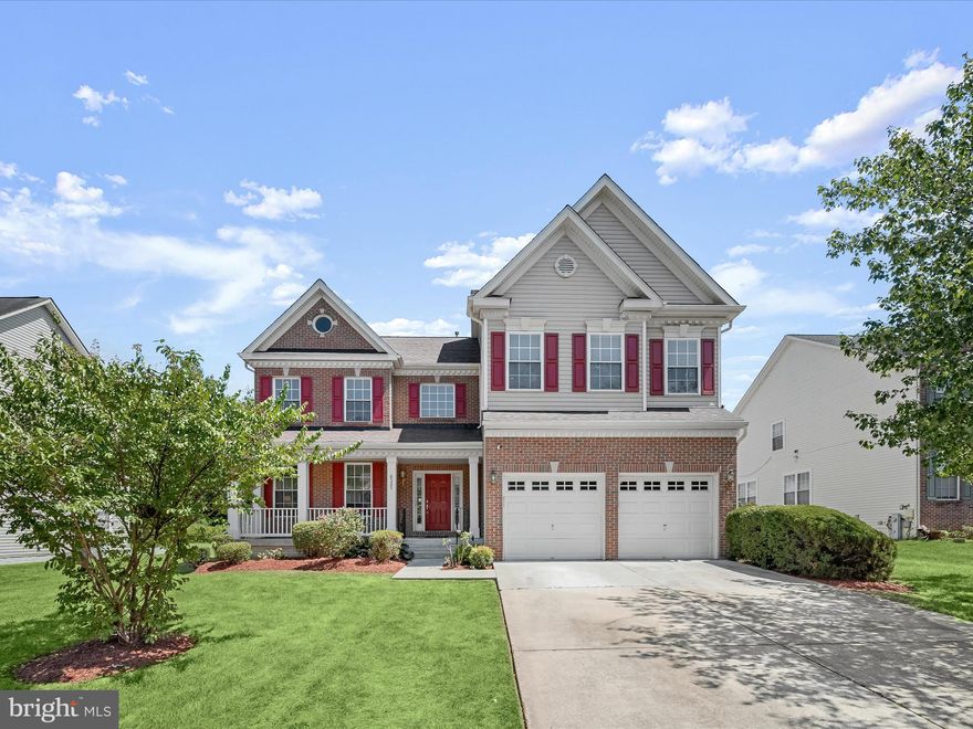 PRICE REDUCTION!!!  Welcome to this exquisite brick-front Colonial in the prestigious Glenn Estates community of Lanham. Offering over 5,000 sq. ft. of luxurious living space, this home has been thoughtfully updated with a new roof, new water heater, new appliances, and fresh paint. The grand two-story foyer with hardwood flooring opens to a sunlit living room and formal dining room. The open floor plan features a chef's kitchen with a breakfast nook leading to a deck and a family room with a gas fireplace. The main level also includes a home office and powder room. The primary suite boasts a wrap-around walk-in closet and luxury bath with a soaking tub, dual vanity, and separate shower. Three additional bedrooms, a bonus room, and a full bath complete the upper level. The finished lower level includes a fifth bedroom, full bath, bonus room, storage, and a walkout recreation room. Outside, the expansive deck and beautifully landscaped grounds create the perfect setting for outdoor entertaining. Enjoy the community amenities, including a clubhouse and pool, which enhance the experience of living in this elegant and modern home.