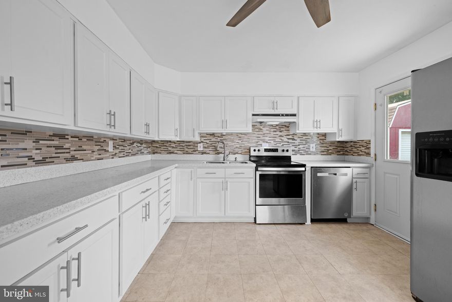 OVER THIRD OF AN ACRE! Charming with Value and thoughtfully designed, this home offers efficient one-level living with no steps to climb. The modern kitchen features sleek quartz countertops, stainless steel appliances, and plenty of space for a dining table to gather with friends. Updates included Fresh Pain, New Carpeting and NEW ROOF w/ WARRANTY only 2 yrs Young!  An open-concept great room seamlessly connects the kitchen and living areas, creating a warm and welcoming flow. With three bedrooms, two full bathrooms, and a convenient laundry room all on the same floor, comfort and functionality are built in. . Step outside to a large, fully fenced yard ..ideal for outdoor entertaining, play, or simply relaxing in your own private space. And with no HOA, you’ll love the value and freedom this home provides.