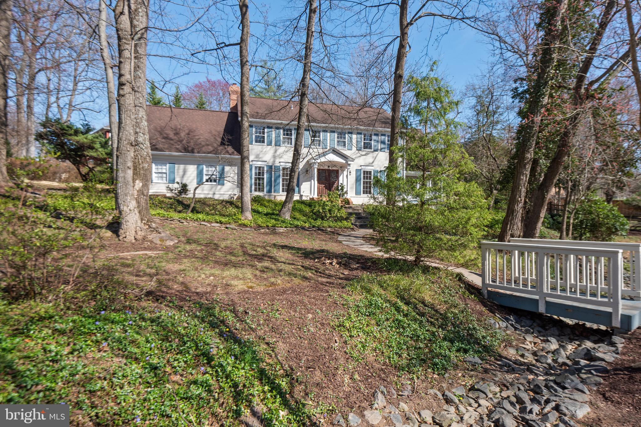 The personal representative of the estate will review OFFERS on Wednesday evening.
Charming Williamsburg Colonial less than a half a mile from the Potomac Village! This rarely available gem awaits your personal touch and vision, offering an exceptional canvas brimming with character. Situated on a prime elevated half-acre corner lot adorned with mature hardwood trees and meticulous landscaping throughout the yard, this home has serene views and is flooded with natural light.
Spread across three levels, the ideal floor plan encompasses over 4,600 square feet of living space. With five large bedrooms and three full baths on the sleeping level and plenty of storage, you won’t have a lack of spaces to reimagine. The heart of the home lies in its warm traditional layout, featuring a grand entry, formal living room, dining room, study, and a large family room with a cozy wood-burning fireplace. A large sunroom addition with an attached covered porch has enchanting views of the lush side yard and the spacious kitchen is open to a sunny breakfast area providing comfortable living spaces. The owner's suite features large walk-in closets, a separate office/sitting area, and an en-suite bath with separate tub and shower.
Outside, enjoy the fully fenced yard with a large side yard and several hardscape and shaded sitting areas, along with a charming stone pond. Ideally located with easy access in and out of the neighborhood from Falls Road or River Road and there's even a convenient shortcut walking path that leads to Potomac Village. Additional highlights include a finished lower level offering plenty of space and storage, a high-efficiency heat pump system installed around 2019 with natural gas backup, and a 2-car garage connected to a large mudroom. Matterport 3D Tour and 2D Floorplans in the documents. Open Sunday 3/17 from 2-4.