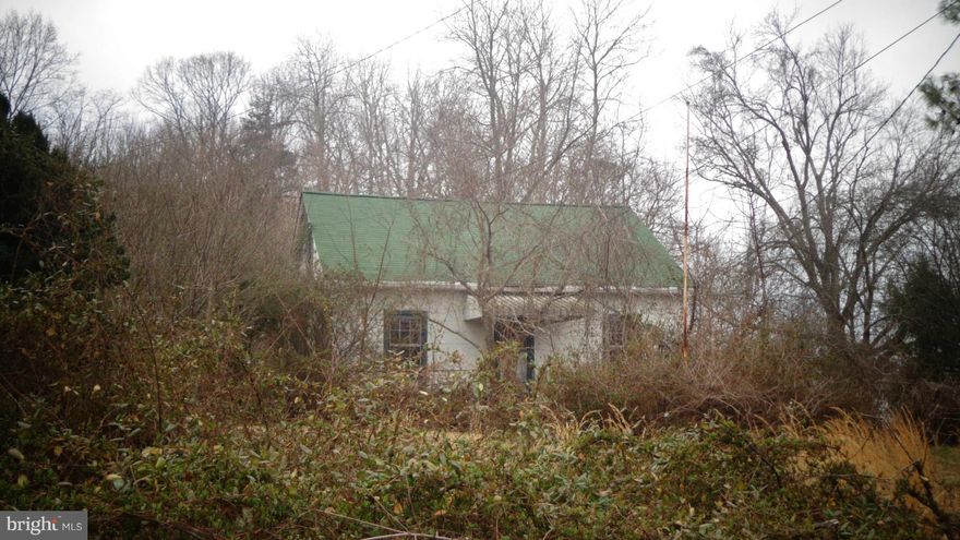 This lot is being sold with another lot-  40- - - -146, totaling 72.97 acres! There is an uninhabitable home on the property, please DO NOT ENTER.