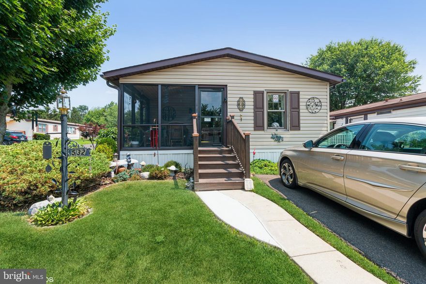 Move in right in to the simple life. Perfect 2 bdrm rancher. Come up to the enclosed front porch with plenty of space to use as an additional room. Inside is move in ready. The floor plan is open with the living room, dining room, and kitchen all open. The kitchen is modern with stainless appliances. The main bedroom is large and has it's own private bathroom. There is an additional bedroom and a full bathroom. Additional features include separate laundry room, side deck, professional landscaping, central air, and 2 parking spaces. Located in a great community with clubhouse and pool.