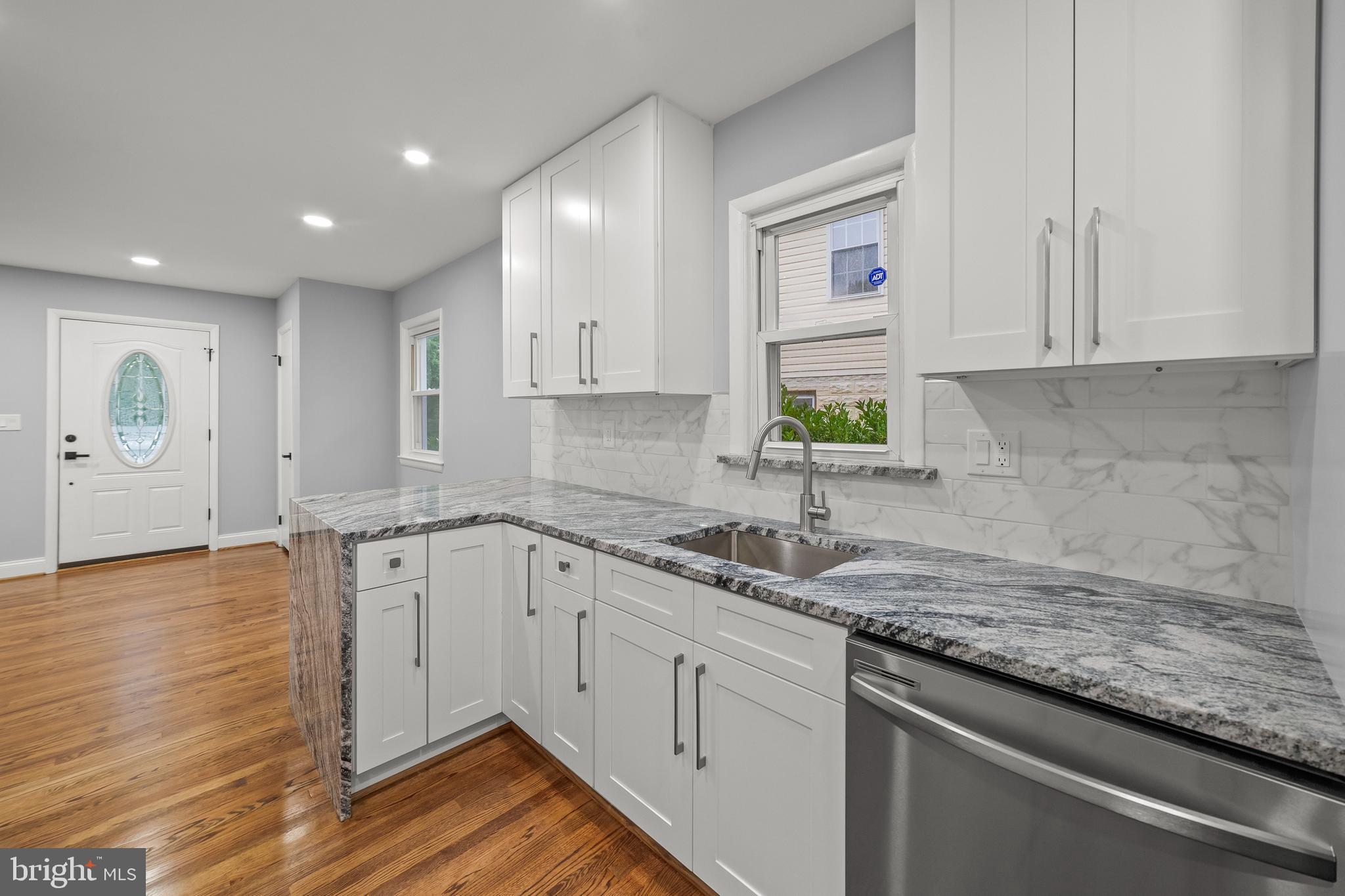 Introducing 58th St. This is a 2 level, 5 bedroom, 2 bath, roughly 2100 SF home located in a quiet neighborhood in sought-after Berwyn Heights. The house comes FULLY renovated and includes:
****
Two levels, new paint everywhere both inside and out, Deck, LARGE shed, fresh landscaping, modern black fixtures, new nest thermostat, door bell, washer & Dryer, freshly stained original hardwood on the top floor, new LVP flooring throughout basement level, new lighting throughout with most being recessed LED’s, new baseboards, new door handles-hinges-door stoppers, decor light panel switches, all new receptacles, registers, and smoke detectors. Practically everything has been modified or replaced. (All recessed Lights are currently set at 5k/Daylight, they are adjustable and can be set to 4K/Natural white or 3k/warm white color light as well)
****
The kitchen has new Samsung Stainless steel appliances, a quiet garbage disposal, Carrara style subway tile backsplash, Viscon white granite, new soft-close shaker cabinets equipped with modern cabinet pulls, and independent recessed lights.
****
All Bathrooms have been fully renovated with marble/granite/quartz vanity tops, shaker style vanity, mirrors, duel flush toilets, lighting, new tile, and new faucet/fixtures.
****
The main bathroom has a new tub with modern grey Madison tile, highlighting a hexagon marble accent stripe and shower niche. The floor is Carrara tile.
****
The BSMT Bathroom has Carrara tile featuring marble accent stripe, marble shower flooring with recessed marble/tile shower niche, large shower head with wand, and Grey Madison tile flooring.
****
This house should go fast!!! Check out the video and see for yourself.
