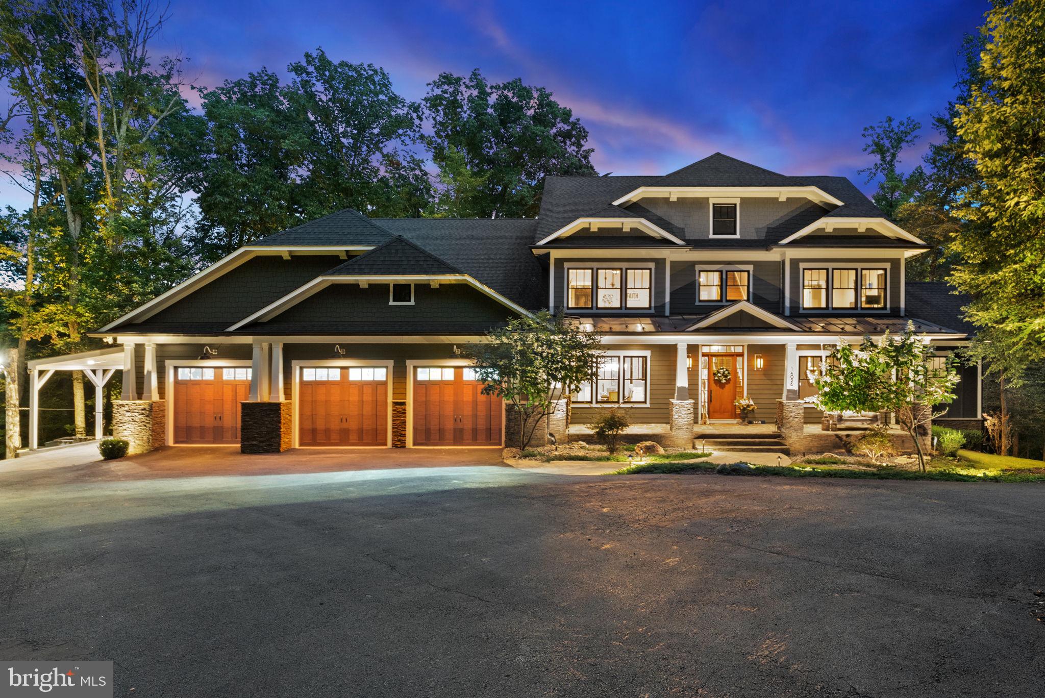 An Extraordinary Leesburg Estate: A Masterpiece of Luxury and Nature. Experience unparalleled luxury, privacy, and exceptional craftsmanship at this custom-designed craftsman estate, a truly unique offering in Leesburg, VA. Spanning 9,600 square feet, with 7 bedrooms and 7 full bathrooms, on 11 wooded and private acres. This spectacular retreat is a seamless blend of timeless style and modern industrial touches, with clean lines, cedar timbers, and expansive glass doors that connect you with nature's beauty at every turn. The home itself is a testament to durability and design, featuring an Eldorado stacked stone facade, Hardie-Plank siding, and a welcoming cedar timber front porch.
Step inside to discover a home built for both beauty and function. The modern open concept layout, 10-Ft ceilings, variable-width white oak floors, 8-foot solid wood doors, and oak staircases span all four levels. The open-concept main level is anchored by a stunning stone feature wall with a fireplace in the living room, creating a warm and inviting atmosphere. The heart of the home is the gourmet main kitchen, a chef’s dream with quartz countertops, Craftsman shaker cabinetry, three sinks (main, prep, and beverage), three commercial sprayers, a wine glass sprayer, and a built-in composting station. An adjoining prep kitchen (2nd kitchen) offers marble counters, a farm sink, and a new refrigerator with a cocktail ball ice feature.
On the second level, the luxurious primary suite is a private sanctuary, featuring a professionally designed backlit closet, petrified wood sinks, heated floors, a steam shower with digital Kohler controls, a heated towel warmer, and a Jacuzzi tub. A private rear porch off the sitting area provides a peaceful retreat for morning coffee or an evening read.
The 3rd Upper Level is perfect for a home office or bedroom with full bathroom and bonus room.
This home offers a variety of unique rooms, each with its own attractive aesthetic and function. Entertain guests in the bourbon room or select a vintage from the dedicated wine cellar. Productivity is a pleasure in the home office, while wellness is prioritized with a fully equipped workout room and sauna. For added peace of mind, a hidden safe room is cleverly concealed behind a bookshelf.
The outdoor spaces are equally impressive, enjoy the TimberTech porch with heated ceiling zones that leads down to a true resort experience with the elegant, heated pool, professionally built and serviced by Town & Country, featuring a bluestone surround and exterior accent lighting on the trees and hardscape. The nature lover will enjoy the lovely trails for a relaxing evening walks or exhilarating morning runs.
Nestled on a tranquil parcel and bordered by a 50-acre conservancy, the property offers a serene escape with mountain biking trails, frisbee golf, and a fishing pond just beyond your backyard.
This Leesburg estate is more than a home; it's a lifestyle—a perfect blend of luxurious living, smart design, energy efficiency, and endless potential in a serene setting with unmatched access to nature and recreation.