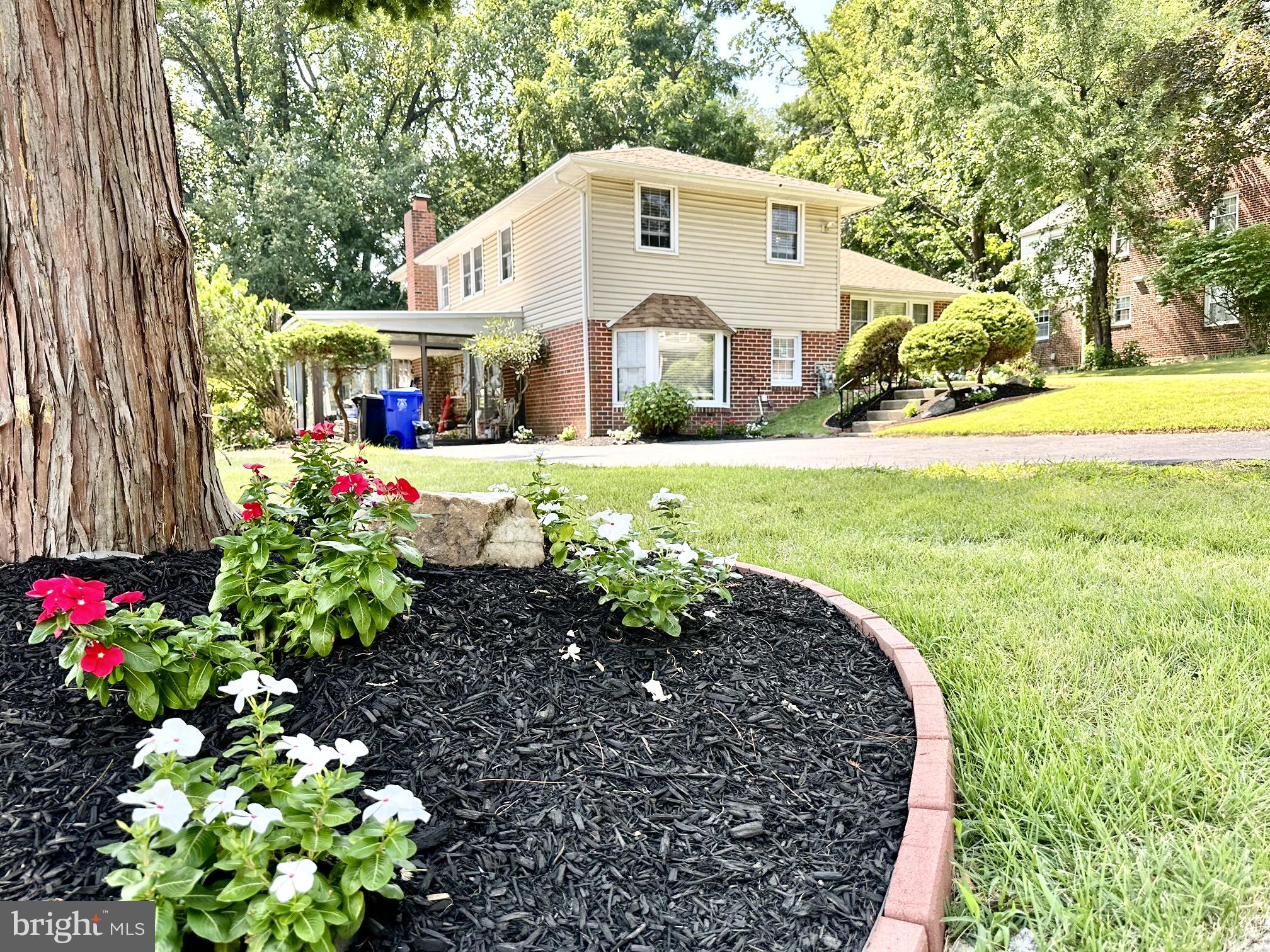 Welcome to an updated and well maintained split level home in a serene neighborhood close to local shops, parks ,schools and the City. Enter to find beautiful wide plank Engineer flooring and fresh paint throughout the home. Abundance of natural light and recessed fixtures guide your way in this open floor plan. Kitchen has classic raised oak cabinetry, granite counters, subway tile back splash, and modern appliances . Entertain in the family room with a wood burning stone fireplace for cozy atmosphere or step into the large glass enclosed sunroom through the sliding door for covered outdoor experience. Bathrooms are updated with gorgeous tile work and accented with quartz top and modern fixtures. Garage has been converted for extra living space but, there is plenty of parking in the large driveway. Roof was replaced in 2012. Enjoy all indoor comforts with energy efficient insulated windows or step outside to the large deck to take in the beautiful views of the tree lined scenic back yard. All offers will be review.