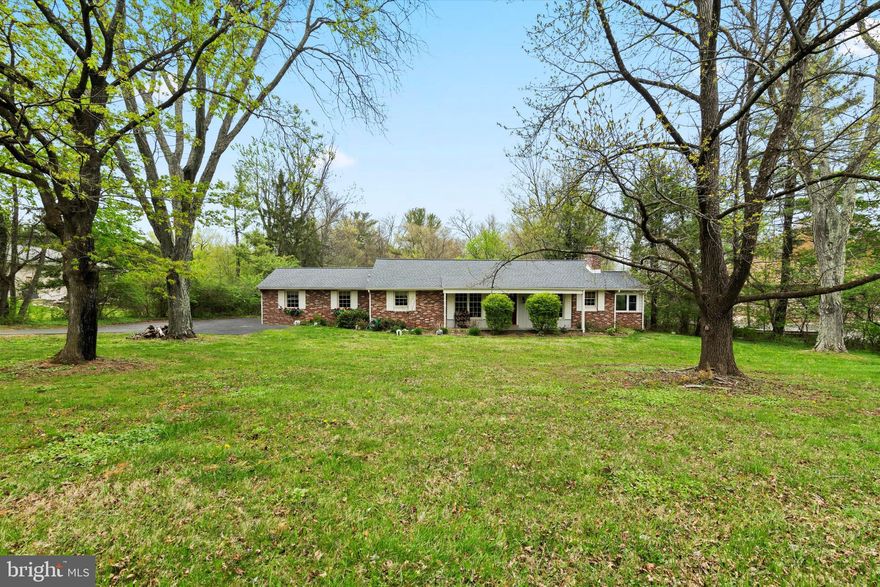 Great Opportunity! Brick rancher situated on scenic 2 ACRES in Whitemarsh Township. One story open floor plan with a ton of potential. Neat opportunity to secure a solid home in need of cosmetic updates in Whitemarsh Township.  Highlights include Newer roof, spacious sunroom (17 x 11) with several newer large 9’ windows overlooking front, side and rear yards. The kitchen features granite countertops, newer stainless steel GE appliances, countertop bar, opens to dining room and walk out access to large wooden deck (25 x 16) overlooking rear yard. Full unfinished walk out basement with 50-gallon water heater (2019) and water filtration system (2018).  Walk upstairs to unfinished attic (45 x 14) great for storage. Property being conveyed in As Is condition.  The location is terrific – easy access to Blue Rte, Turnpike, Ambler, Chestnut Hill, etc. Also being marketed as a potential 2 acre building lot.