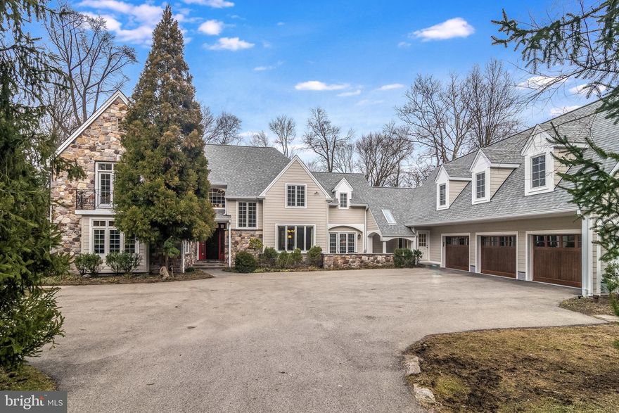 Dream Location just steps away from the walking, horse and biking trails of Valley Green and Wissahickon Park, this 19 year old French colonial located in Springfield Township, on the borders of Chestnut Hill and Whitemarsh, with brand new Roof and brand new Hardie-Plank siding will capture your heart with its open design and special charm. Built by Cherokee Construction, and surrounded by professional, colorful, mature specimen landscaping, the grounds feature multiple covered and uncovered patios and a 4.5' deep, heated pool with whirlpool jets, all overlooking conserved open space. A courtyard parking area leads to the covered front door. The 1st floor provides a fabulous open floor plan, with hardwood floors accenting each room. The spacious Living Room features a floor-to-ceiling stone fireplace, custom shelving and a door to the rear Patio. A cozy Family Room with 2nd floor-to ceiling stone, wood-burning fireplace, custom built-ins and a private covered Patio could also serve as a 1st Floor Bedroom, as it is located adjacent to an updated Full Bath with pedestal sink and stall shower with frameless glass door. The incredibly large Office includes a wall of custom built-ins, walls of windows and a door accessing another Patio. The Gourmet, updated Kitchen is open to the Breakfast Room, Dining Room and Family Room, ideal for private or entertaining pleasure. The Kitchen features a Viking stove with griddle, Dacor wall oven and warming drawer, Bosch dishwasher, granite counters, island with oversized stainless sink plus 2nd sink along the perimeter, Subzero refrigerator and pull-out shelving, 42" cabinets and a warming drawer, and a door from the Kitchen opens to a delightful flagstone covered front porch, perfect for morning coffee, afternoon tea or a candle-lit dinner. The sun-drenched Dining Room includes crown molding and a chair rail. An amazing all-year-round Sun Room with insulated shades is accessed from the Breakfast Room and features tiled flooring, a wet bar with granite counter, vaulted wood ceiling and a wall of windows with sliding door to the rear Patio. A terrific Mud Room offers a Powder Room, 2 walk-in Pantry Closets plus multiple additional closets and access to the 3 Car Garage. 2 sets of Stairs provide access to the 2nd Floor with brand new hall carpet. The Master Bedroom Suite includes the bedroom with Juliet balcony includes a vaulted ceiling and stereo speakers plus 2 walk-in closets and an updated Full Bath with radiant heated floor, steam shower with tiled surround and frameless glass door, double vanities with granite counters and separate water closet. Bedrooms 2 and 3 share a Jack and Jill Bath, and Bedroom 4 offers an en-suite Full Bath with corian counter and soaking tub with shower. The rear Hall leads to the 2nd Floor Laundry Room with utility sink, followed by a hallway lined with cedar closets, leading to Bedrooms 5 and 6 featuring dormer windows, plus another Full Bath with corian counters, soaking tub and shower. Completing this wing of the house is a sun-filled Office with 10' ceiling. The unfinished basement offers many opportunities, including a commercial sized workshop room with included built-in workbench. Additional exciting features include an attached greenhouse located behind the Garage, a deer fence, new pressure-treated wood retaining wall, sprinkler system, Central Vac, new water heater (2018), Shed, wiring for electric pet fence with collars and Generator. 1 Year Home Warranty included. Excellent Springfield School District with multiple private schools nearby as well. Close to public transportation, with easy access to center city. Imagine walking out your front door, taking a few steps and finding yourself on Forbidden drive. If you have enough energy, you can walk all the way to center city Philadelphia, but you might prefer to ride your bike or your horse instead, and if you get hungry, you can stop in Chestnut Hill or Manayunk for a  bite to eat along the way.