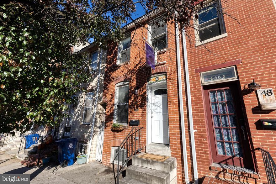 Welcome home to this charming 2-bed, 2-bath row home nestled in the heart of the vibrant Federal Hill neighborhood. Boasting a bright, open‐layout main level where the living room seamlessly flows into the kitchen, this home features exposed brick accents and recessed lighting that bring both character and modern appeal.
On the upper floor you’ll find both bedrooms with high ceilings and fresh carpeting and a full bath, offering a comfortable and stylish retreat from the city pace. The lower level reveals a partially finished basement that includes a second full bath, dedicated laundry space, and additional storage space. Out back, there is a private patio area with a new fence.
With its unbeatable location, you’re just moments from the neighborhood’s best dining, shopping and waterfront views, yet tucked quietly on a middle-of-row block for added privacy and a sense of retreat. Welcome home!