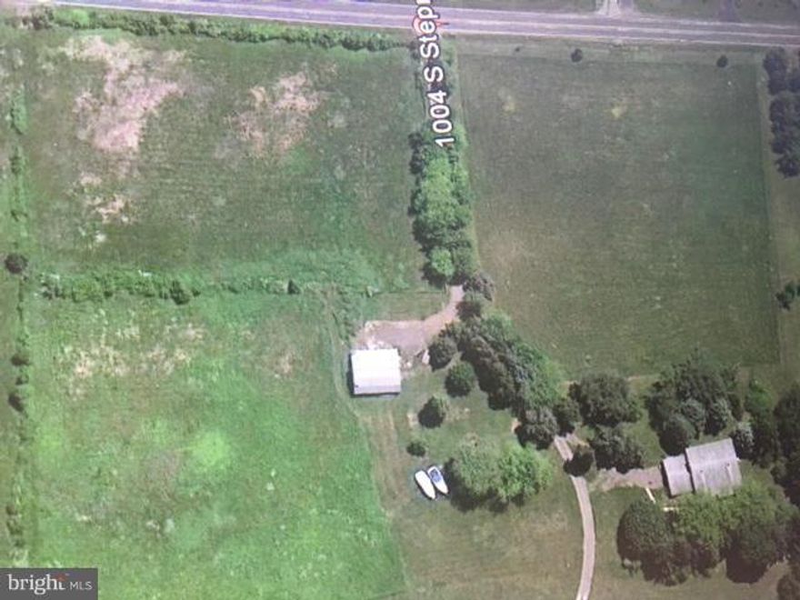 HUGE PRICE REDUCTION! 3 bed/ 2 bath, 2 car garage, The Bones in this house is good, needs a little TLC, you can live in while you create your dream home. A little investment has a big return!, Hugh Sun rm with pellet stove, Large fm rm with wood store, living room with fireplace.barn & fenced pasture for horses. If you ever wanted a farmette  this is your opportunity!  Nested on 11.29 Acres.