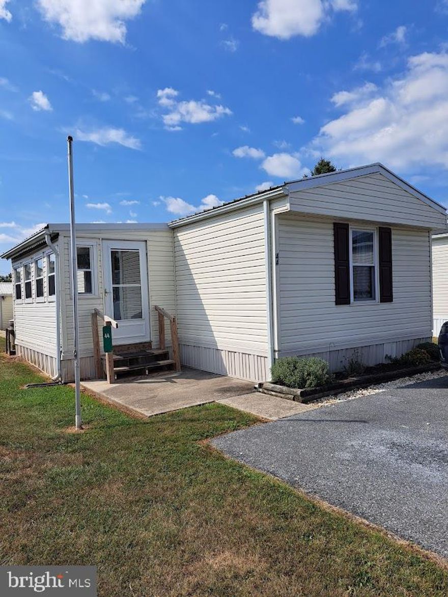 Look at this!  A nice mobile home and a workshop!  Welcome to this quiet 55+ senior community, located within Ephrata! Blue Bell Mobile Village is nestled in the rural area of Clay Township. Enjoy the peaceful surroundings, while still being close enough to drive to the historic parts of Ephrata and Lancaster County! This home is a well-maintained 1986 Skyline single-wide model. The main entrance to the home features a carpeted sunroom to enjoy the serenity of the rural surroundings. The home features a primary suite at the back of the home with a full bath and walk in closet. The other two bedrooms and a second full bathroom are located in the front of the home. The laundry includes a washer and dryer. The utility shed behind the home has been transformed into a workshop area for lots of different types of projects! The workshop is 15'5'x8', has lots of electric outlets, work lights, work bench, shelves, a side man door and 4'8" double doors!  Lot rent is $465 per month, and includes trash and snow removal. Parking is available directly in front of the home, and additional guest parking is located at the entrance to the community. This sale will be "as is". Power of attorney for the seller is not able to make repairs.