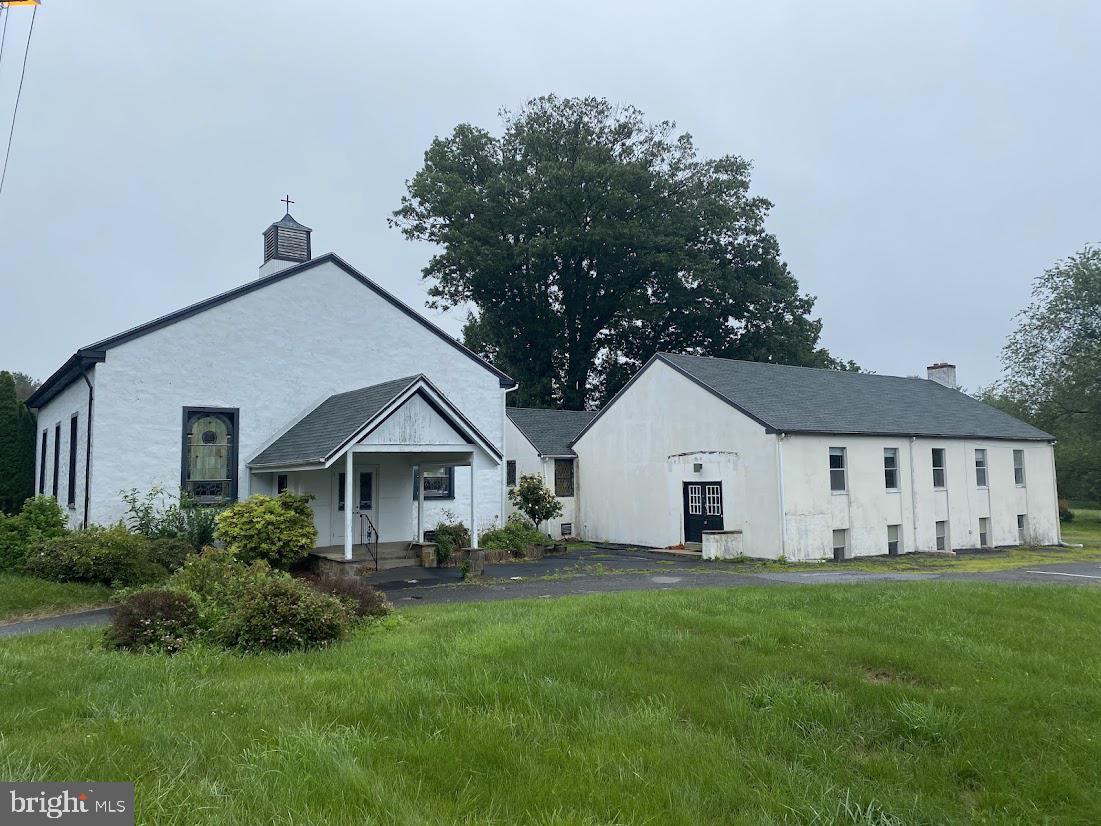 Versatile redevelopment opportunity in Edgmont Township. This former church property sits on a prominent 3+ acre corner lot at the intersection of Middletown Road (PA-352) and Sycamore Mill Road, offering a rare blend of visibility, privacy, and access to nature in a sought-after area of Delaware County.
Zoned R-1 Residential, the property is permitted by right for religious, cultural, and institutional uses, including functions, schooling, retreats, and community events. The existing building footprint provides a solid foundation for adaptive reuse.
Buyers may explore a variety of permitted or conditional uses:
-Conversion to a bed and breakfast (conditional use)
-Residential conversion with space for a large garage, studio, or workshop
-Possible subdivision (minimum lot size is 2 acres; variance required)
-Possible r
Environmental and engineering work has already been completed. The property is also served by public water and on-site septic. Extensive septic testing has been completed, with multiple perc test approved locations — enhancing flexibility for future possibilities.
Access currently exists from Middletown Road, but the lot also allows for private access from Sycamore Mill Road, which may be preferable for residential or lower-traffic uses.
The property is directly attached to Ridley Creek State Park, offering unparalleled access to trails, woodland, and open space—ideal for uses centered around wellness, retreat, education, or recreation.
Located just minutes from Media Borough, West Chester, and major commuter routes, 1223 Middletown Road offers a rare combination of historic charm and functional space. Whether you are a nonprofit, religious group, residential builder, or owner-user seeking a creative live/work concept, this property presents a compelling canvas for transformation.