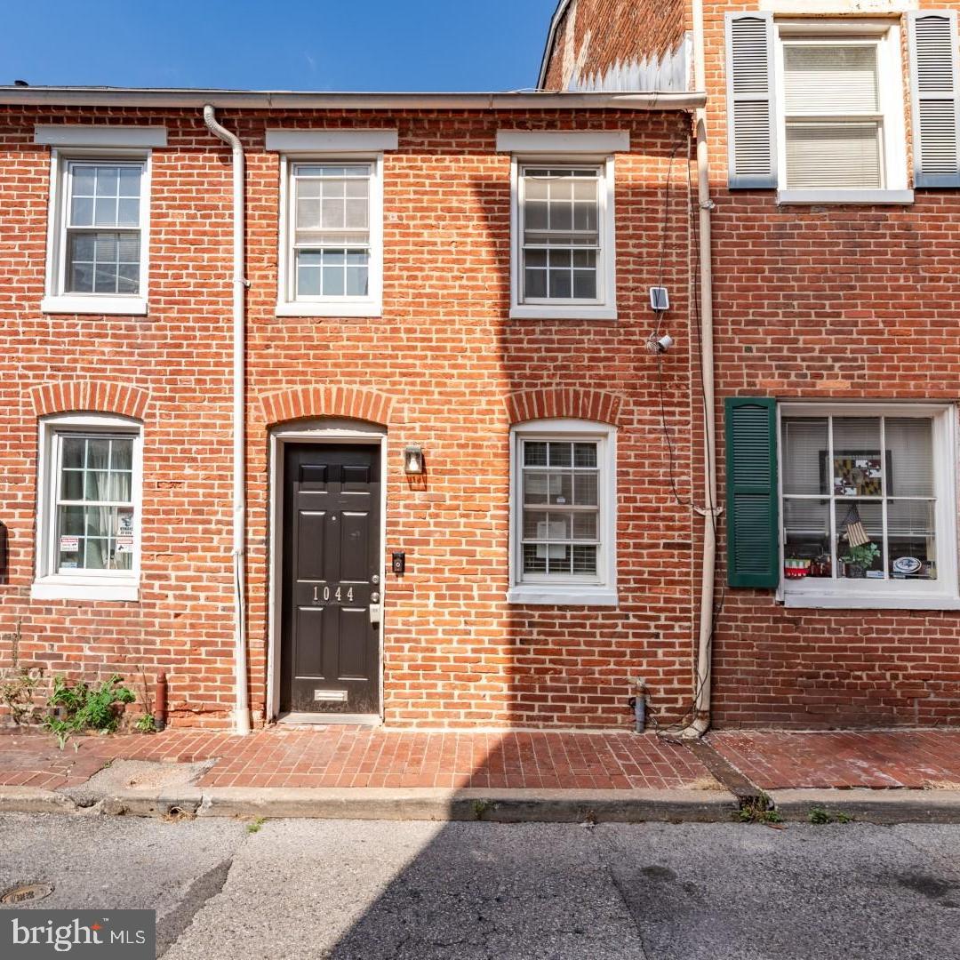 Discover the perfect blend of comfort and convenience in this recently renovated 2-bedroom, 1-bathroom home, nestled in the vibrant heart of Baltimore. Boasting vaulted ceilings that enhance the sense of space and light, this residence invites relaxation and style. The primary bedroom is a serene retreat, complete with access to a sleek balcony that offers tranquil views of the charming courtyard below. Modern living is assured with stainless steel appliances, a front-loading washer and dryer, and elegant hardwood floors that flow seamlessly throughout the home. Situated in a dynamic neighborhood, this property is just a short stroll away from the bustling downtown area, offering an urban lifestyle without compromise. Sports enthusiasts will appreciate the proximity to the iconic Camden Yards and M&T Bank Stadium, making it easy to catch a game whenever the mood strikes. This home is not just a place to live; it's a canvas for your life, ready to be filled with new memories! 700 credit score and 3 times rent required.