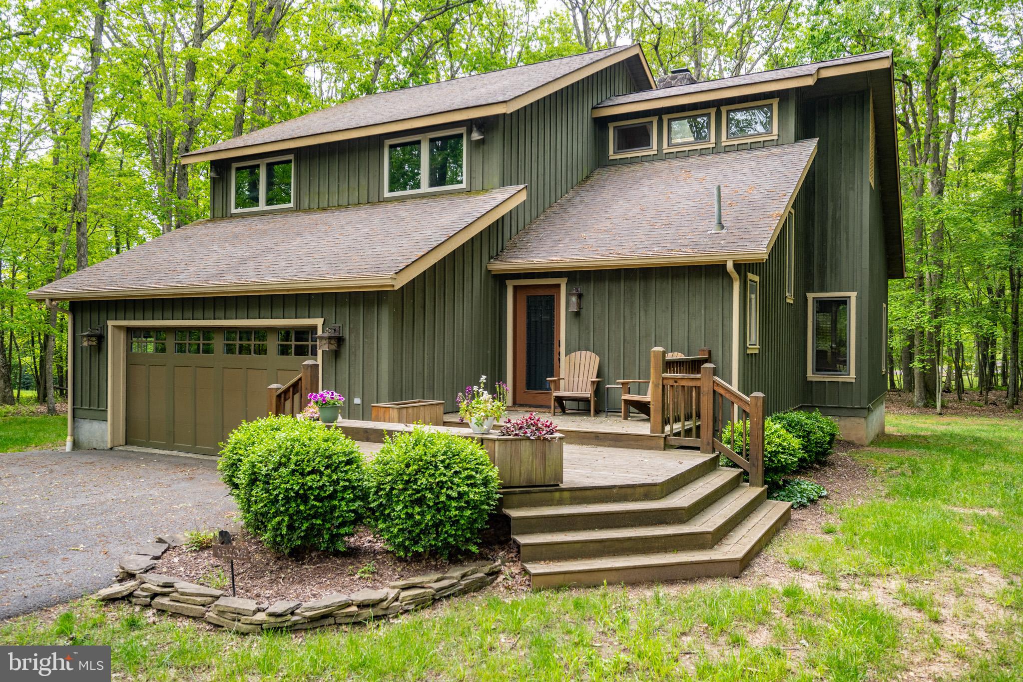Tucked in the trees at The Blakeslee, this 3-bed, 2.5-bath home delivers space, style, and a dock slip just down the road! Fresh interior paint throughout. Beautiful sunroom soaked in light—easily the best room in the house. Spacious back deck and brand-new hot tub make the outdoor setup just as strong. Inside, you’ve got a pass-through stone fireplace, stainless appliances, central A/C, and a comfy, open layout. Oversized garage turned rec room with new game tables. Bedroom windows updated for rental compliance. Flat, wooded acre with privacy to spare. The perks don’t end with the house – Community amenities include trails, indoor pool, tennis courts, and more. Don’t miss your chance to own in one of Deep Creek Lakes most desirable communities… call today for details!