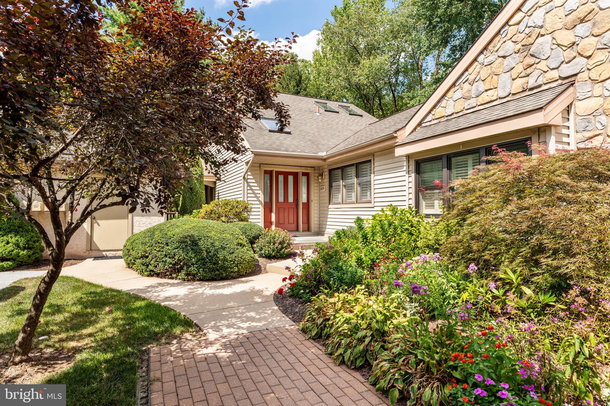 Welcome to 629 Glenwood Lane, an expanded Brandywine model in the highly sought-after Hershey’s Mill 55+ community! This 3-bedroom, 3-bathroom end unit is a rare find with an unbeatable setting: tucked away in a cul-de-sac and backing to designated open space. Enjoy a low-maintenance, carefree lifestyle with access to a wide range of amenities, including a Community Center, library, swimming pool, tennis and pickleball courts, wood shop, scenic walking trails, and the nearby golf course and clubhouse. As a new resident of Hershey’s Mill, you’ll also receive a complimentary one-year social membership—perfect for getting to know your new neighbors!
As you approach the home you’ll appreciate the convenient breezeway, providing access from the garage to the home. The inviting ambiance of the home is underlined by the skylights in the entryway. The balance between the living and dining rooms makes for a seamless flow during hosting. The kitchen is spacious, with plenty of counter and cabinet space, and looks out onto the cozy breakfast nook. Enjoy the lovely wooded backdrop from the screened-in porch off of the dining room, or the rear patio off of the breakfast nook. The primary suite includes a door to the private terrace, a walk-in closet, and an en suite bathroom complete with an oversized tub and dual sinks. A second bedroom and bathroom complete the main level of the home. Upstairs you’ll find the fully finished loft, a flexible space with a third bedroom and en suite bathroom. The lower level is a finished space with an office and plenty of storage too.
Ideally located nearby the boroughs of West Chester and Malvern, Hershey’s Mill provides a location convenient to the Main Line while still maintaining the atmosphere of a private, close-knit community. With the Malvern train station nearby, commuting into Center City Philadelphia is a breeze. Experience low-maintenance, blissful living with amenities that include a Community Center, library, pool, tennis courts, pickleball, wood shop, walking trails, and, of course, the nearby golf course and clubhouse. A golf club membership is available for an additional fee. Shown by appointment - Come visit, and discover what makes Hershey’s Mill so popular!