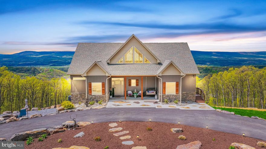 Welcome to your luxurious mountain haven, overlooking 7+/- acres of picturesque land with breathtaking mountain views located in Round Top Estates.  This custom-built home offers the perfect blend of sophistication, comfort, and peace. Boasting large gable tented windows, wood accents, open concept floor plan, luxury vinyl plank flooring throughout the home, 8 ft. doors, gas floor to ceiling stone fireplace, and vaulted ceilings. Chef's kitchen with upgraded stainless-steel appliances, granite countertops, butcher-block two-tier island top, white cabinets, farmhouse sink, and a backsplash to tie it all together. Each bedroom has its own luxurious bathroom giving you privacy. Primary bedroom suite has vaulted ceilings, huge tile walk-in shower, separate soaking tub, and his/her sink, and a walk-in closet.   Step outside onto the two-tiered deck.  you'll find an exterior gas stone fireplace, providing the perfect ambiance for outdoor gatherings or roasting marshmallows under the stars. With over 2,000 square feet of deck space, there's plenty of room to entertain and soak in the beauty of your surroundings.
Downstairs, the fully finished basement offers additional living space, including a kitchenette and a comfortable bedroom with a full bathroom, making it ideal for guests or as a separate living quarter. Plus, for added peace of mind, there's even a safe room for extra security.  Driveway loops around, providing ample parking space and easy access. 
This stunning property will not last long!