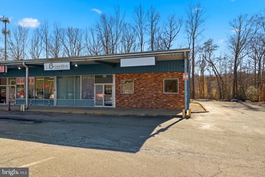 Prime end-unit commercial retail space located directly on Southern Maryland Blvd (Route 2/4) in Lothian, MD. This high-visibility corridor offers exceptional exposure, strong daily traffic counts, and excellent roadside frontage.

Delivered as a dark cold shell, this space provides a blank canvas for retail, restaurant, medical, or service-based users seeking to design their ideal layout. End-unit positioning offers enhanced signage visibility, additional natural light potential, and possible drive-thru configuration (subject to county approvals and permitting).

The adjacent unit is also available for sale and features a full buildout suitable for spa, office, or retail use — presenting a unique opportunity for an owner-user expansion, multi-tenant investment, or complementary business concept.

Strategically positioned in a high-demand commercial corridor within Anne Arundel County with convenient commuter access and strong consumer traffic flow.