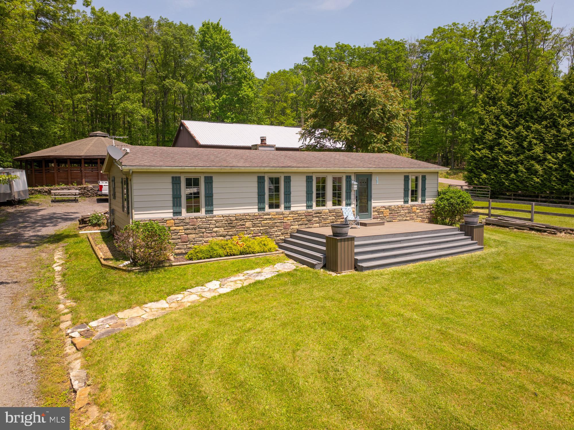 Location, location, location! Partially remodeled 3BR 2BA rancher on 1 acre in McHenry with GORGEOUS farm & mountain views. Less than 2 miles to Deep Creek Lake and Wisp. Property sits outside of lake zoning, so the sky is the limit with potential. You will be shocked at how much value can be built on to just one acre of land! Previously used as a horse stable and riding area - could be perfect for homestead or small farm & garden. Incredible location with commercial style building, large garage door openings, plenty of storage space for machinery, vehicles and boats. Updated furnace, well and trex decking. Home is mid-renovation but property will convey with many remaining materials needed to complete bathroom renovations, etc. Confirmed with University of Maryland extension office that you can have multiple horses - verify for details.