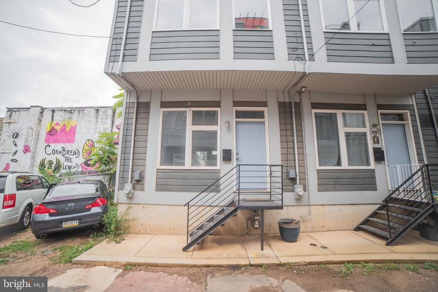 This beautiful home, in the trendy neighborhood of Brewerytown, is minutes from local restaurants and the scenic views of Fairmount Park. The first floor features an open living room and kitchen design with Tierra Bianco granite countertops, stainless steel appliances,  white Wolf shaker style cabinetry and plenty of window space for natural light. Off of the kitchen is the backyard with plenty of space for entertaining and relaxation next to the public mural from the adjacent building next door. Included are three bedrooms and two and a half bathrooms with a walk-in closet and laundry room  and wet bar with granite countertop. Central A/C and Forced Air Heat. The finished basement with a ceramic tile floor and a half bath can be used for storage, office space, or an additional living space of your choosing.  Atop the third floor is the rooftop space for additional entertaining or rooftop gardens with great views of the city.