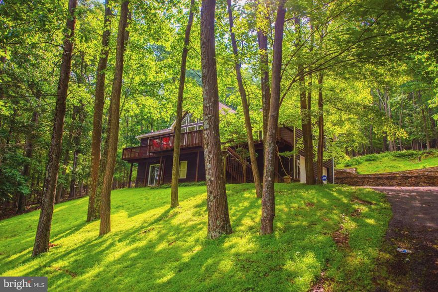 SPACIOUS CHALET WITH VIEWS OF THE VALLEY BELOW / EXTENSIVE STONE TERRACING IN BACK YARD / BACKS TO APPALACHIAN TRAIL / JUST REMODELED WITH NEW ARCHITECTURAL SHINGLE ROOF, NEW GRANITE COUNTERTOPS, NEW STAINLESS APPLIANCES & PAINT. CEDAR SIDING RECENTLY STAINED & NEW $6K LEAF GUARD GUTTER SYSTEM. GREAT ROOM WITH CATHEDRAL CEILING / THEATER ROOM WITH SEATING / HARDWOOD FLOORING & GAS FIREPLACE / GREAT INDOOR AND OUTDOOR SPACE FOR ENTERTAINING. SOME FURNITURE IS NEGOTIABLE. MAKE YOUR APPOINTMENT TO VIEW THIS BEAUTIFUL HOME NOW. BEST TO USE THE DIRECTIONS INCLUDED IN THE LISTING, GPS WILL GET YOU THERE BUT VIA A MUCH MORE INDIRECT ROUTE