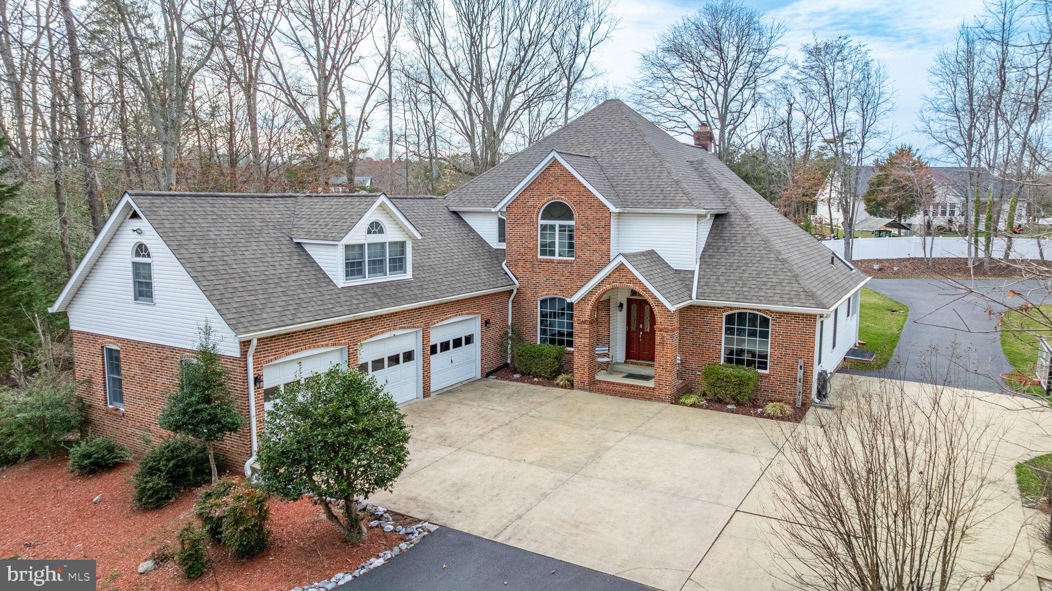 Prepared to be WOWed by this unique home in Hughesville. Calling all car enthusiasts-If you are looking for garage space, then look no further! This home has a 3 car attached garage & a 3 car detached garage with LIFT! Are you looking for a first floor primary suite, then look no further! This home is filled with charm & coziness. The open floor plan boasts a 2 story great room with a propane gas fireplace. This opens to the Kitchen with HUGE island, a breakfast bar for seating, granite counters, stainless appliances, and tons of cabinets & prep space! The living room could also be used a separate dining room, mudroom with laundry & half bath round out the first floor. The 2nd floor has 3 ample size bedrooms, and a full bath. Above the 3 car attached garage you will find a separate BONUS room with a full bath, that you can use as a rec space, a bedroom, an in-law suite or whatever you desire. Relax on your covered back patio & sit watch the nature in this large flat backyard. There is also a large storage shed outside & room for other structures if needed. NEW ROOF - 2020, updates to HVAC 2017. The location cannot be beat. Located right off of Rt 5 for easy commuting north or south, & right on the county line of St Marys & Charles, you can enjoy nearby shopping & dining. Did I mention the 6 GARAGE BAYS and the CAR LIFT? Set up a showing to see this home today!