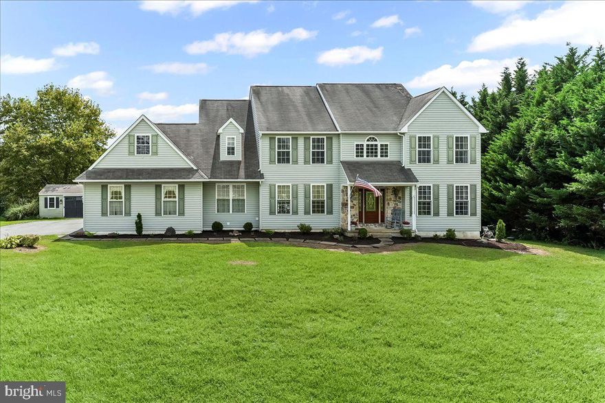 Welcome to this beautifully designed stone and siding home offering a perfect blend of elegance and functionality. The foyer greets you with hardwood floors and wainscoting, setting the tone for the attention to detail throughout. A formal living room/office features hardwood floors, crown molding, built-in bookcases, and abundant natural light, while the formal dining room provides the ideal space for entertaining. The gourmet kitchen boasts recessed lighting, crown molding, an abundance of gray cabinetry, granite countertops, a granite island, tiled backsplash, and a stunning Palladian window. The kitchen flows seamlessly into the breakfast area with sliders to the back deck, as well as the spacious family room featuring crown molding, walls of windows, and a propane fireplace. A laundry room with cabinetry, powder room, and a two-car garage with workbench areas and walk-up attic storage complete the main level. Upstairs, the luxurious main bedroom suite offers a tray ceiling, walk-in closet, and spa-like bath with double sinks, soaking tub, and separate shower. Three additional bedrooms and a large tiled hall bath complete the upper level. The lower level is designed as a full in-law suite with a slider to a concrete patio, living room with hardwood floors and beverage station, bedroom with multiple closets, full tiled bath, small gym/den, and utility/storage room. Enjoy outdoor living on the Trek deck overlooking lush grass and mature trees, with access to the concrete patio and a large shed. This home truly offers space, comfort, and versatility for today’s lifestyle.