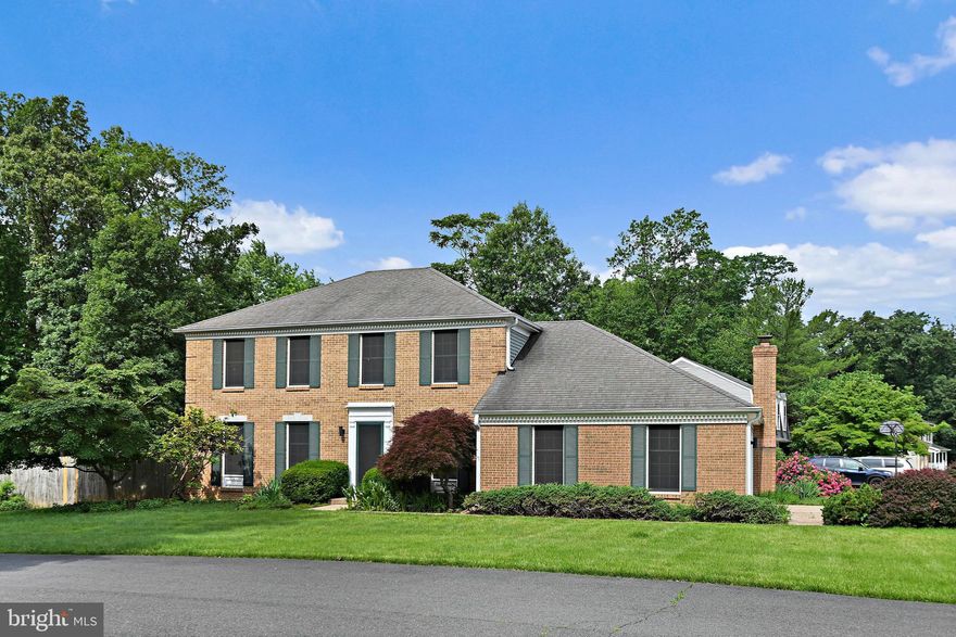 Stately brick-front Colonial situated on a beautifully landscaped 0.30-acre corner lot in a quiet pipestem within a well-established and serene neighborhood.
The home has been stylishly renovated, featuring refinished hardwood floors on the main level, fresh paint throughout, and striking accent walls in the dining room and primary suite. The brand-new kitchen showcases quartz countertops, modern cabinetry, stainless steel appliances, and designer lighting. It opens seamlessly to a cozy family room with recessed lighting, a fireplace, and access to an extended patio and fenced backyard—perfect for entertaining or watching the kids play in the spacious yard while mom prepares meals in the kitchen.
Upstairs offers four generously sized bedrooms, including a large primary suite with a walk-in closet and a fully remodeled ensuite bath. The finished lower level includes a recreation room, a flexible den or home office, and a full bathroom. Additional upgrades include fully renovated bathrooms, new lighting throughout, and an epoxy-coated two-car side-load garage. A rare opportunity to own a move-in-ready home in a prime location! This wont last.