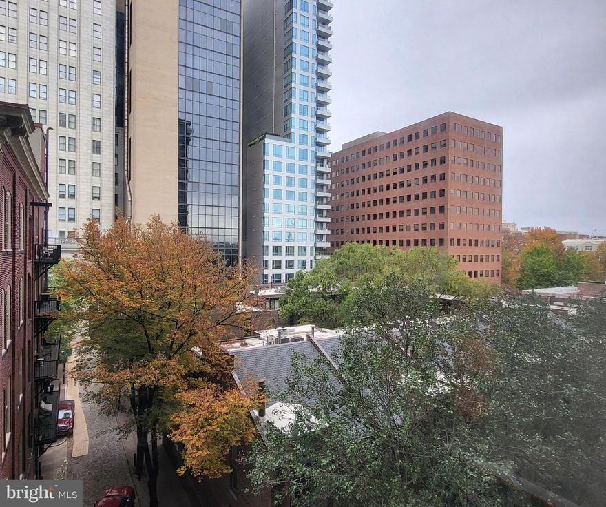 Bright and spacious one bedroom with treetop views at Independence Place, Tower II. Enter through a foyer with large coat closet into the open great room boasting beautiful natural light from floor-to-ceiling windows and ample space for living, dining, and entertaining. Adjacent is the fully-equipped kitchen with excellent cabinet and counter space, stainless steel sink with garbage disposal, and a large passthrough overlooking the great room. The generously sized bedroom has an oversized window, deep wall closet, and walk-in closet. Across from the bedroom is a full hall bathroom with tub shower. There is also a laundry closet with stacked washer/dryer and additional closet and storage space throughout. Don't miss your chance to create your own bespoke one bedroom, right on Washington Square! Residents of Independence Place enjoy a twenty-four-hour doorman and concierge, brand new lobby and state-of-the-art fitness center, on-site management, individual heat & air conditioning controls, and on-site parking with direct access to the building, subject to availability and a monthly fee. Location is everything...Independence Place is located in the historic Society Hill neighborhood of Philadelphia facing Washington Square. Many of the city's finest museums, cultural institutions, theaters and restaurants are only a short walk away. 30th Street Station and Philadelphia International Airport are only minutes away.
