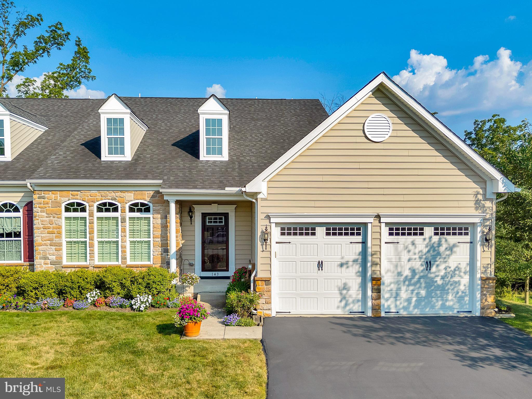 Highly desirable and sought-after Stony Creek Farms is a premier 55+ community nestled in scenic Worcester Township. This stunning end carriage home offers elegance, comfort and carefree living.
Tucked in a private, premium location within the community, this home offers peaceful surroundings and added space.
Inviting covered front entry sets the tone for this warm and elegant home. Upon entry, you’ll be welcomed by warm hardwood floors that seamlessly flow through the living room, dining room, kitchen, family room, office, and laundry room- creating a cohesive atmosphere throughout.
Enjoy the spacious living room with soaring ceilings and bright windows topped with elegant arched transoms. The space flows effortlessly into the open-concept dining room and continues into the kitchen, perfect for both everyday living and entertaining.
The well-equipped kitchen features an abundance of cabinetry with an elegant glass door accent, coordinating granite countertops and island, stainless steel appliances including a cooktop, double oven, pantry and a double stainless-steel sink, making this space as functional as it is beautiful.
Continue into the inviting breakfast room where a cozy gas fireplace with classic surround mantle adds warmth and charm for an ideal spot to relax with guests.
From the breakfast room, access to the spacious, private deck with a retractable awning, perfect for outdoor dining. Enjoy the serene view overlooking the lush green open space that offers both beauty and privacy right outside your door.
Next, step into the private office, framed by a French door and featuring a built-in bookcase with a convenient desk.
The main bedroom, privately tucked away in the rear hallway on the first floor offers a peaceful retreat. It features two generously sized, professionally designed walk-in closets, coffered ceiling with a ceiling fan, and four bright windows that fill the space with natural light.
The luxurious ensuite bath showcases a double vanity, a tiled shower with built in bench, a beautifully tiled floor, and linen closet.
Returning through the hallway, you’ll find a convenient powder room and a well-equipped laundry room featuring handy cabinetry, a utility sink, and direct access to a two-car garage. This completes a thoughtfully designed first floor.
An inviting staircase with decorative, turned handrails and oak tread steps leads to the second-floor loft, which overlooks the grand foyer below.
Upstairs you’ll find a spacious bedroom, a hall bath with a double vanity, and a third bedroom, which is currently used as a private office. This room features exquisite built in bookcases for added sophistication and function.
Plus, for added style and privacy, windows and sliding door are outfitted with elegant plantation shutters.
And it gets better! The walkout -daylight lower level offers an expansive finished space filled with natural light from four full-size windows. Featuring practical ceramic wood look flooring, custom bar with seating for five and a built-in beverage refrigerator. Also featuring a flexible relaxation zone, great for TV and lounging.
The lower level also includes additional closets, powder room, and generous unfinished area ideal for extra storage. Built-in shelving adds organization and functionality.
A French patio door leads to a private paver patio enhanced by a gracefully curved accent wall, creating a truly inviting outdoor retreat.
This community is complete with a clubhouse, gated entrance, mature landscaping, and over three miles of scenic walking trails.
Ideally located, it offers convenient access to the PA Turnpike and Septa’s Landsdale Regional Rail and major roads.
This is a rare opportunity to benefit from the seller’s pride of ownership. Meticulously maintained and thoughtfully planned, this home is ready to be enjoyed and cherished by its next fortunate owner.