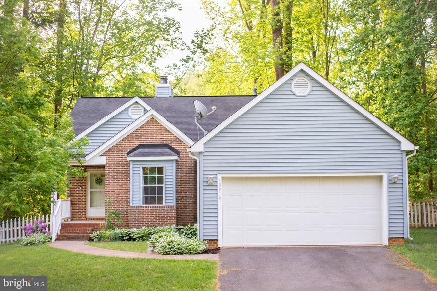 Beautiful, split-bedroom rancher, situated in the heart of a quiet neighborhood, and located so close to town too!!! Come home after a long day and unwind with everything this fantastic residence has to offer. Whether you're cooking up a delicious meal in the kitchen on the ample counterspace, cozying up in the family room with its gorgeous corner fireplace to watch a fun TV show, or relaxing out back on the oversized deck to take in all the surrounding nature, there is no shortage of features to love. Not to mention, with the open floorplan and vaulted ceilings found throughout, everything just feels so bright and airy too. There's even already a fully fenced backyard waiting for you to enjoy. Plus, being just 15 minutes from all manner of shopping, restaurants, entertainment, as well as the interstate, going any which way is a breeze. With all of this and more, we'd love to have you stop by to take a look for yourself today! Can't wait to see you there!!!