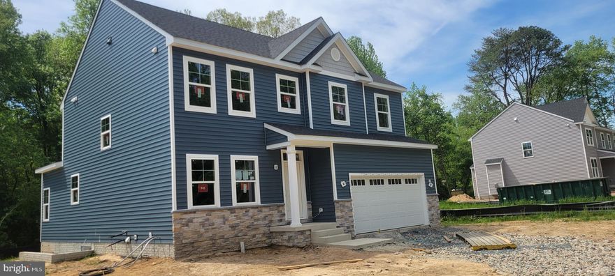 Wagner Homes presents the Camden model. This colonial is sited on nearly 6 acres of beautiful woods. The home features a partial stone front with Pacific Blue siding color. The first floor, with 9ft ceilings, has  a great flow from the entry , living room to the open kitchen with an 8 ft center island. Maple cabinets with  quartz counters. Opens to 16x10 morning room overlooing nature. Upstairs to the bedrooms and laundry area. The owners suite has 2 huge walk-in closets. Tray ceiling Full bath with ceramic floor and shower and soaking tub surrounds. Still time for the Buyers to pick ceramic color, carpet in bedrooms color and counter top color. Looks like a late may or early June finsih. The community has a boat ramp and fishing pier for $55 per year