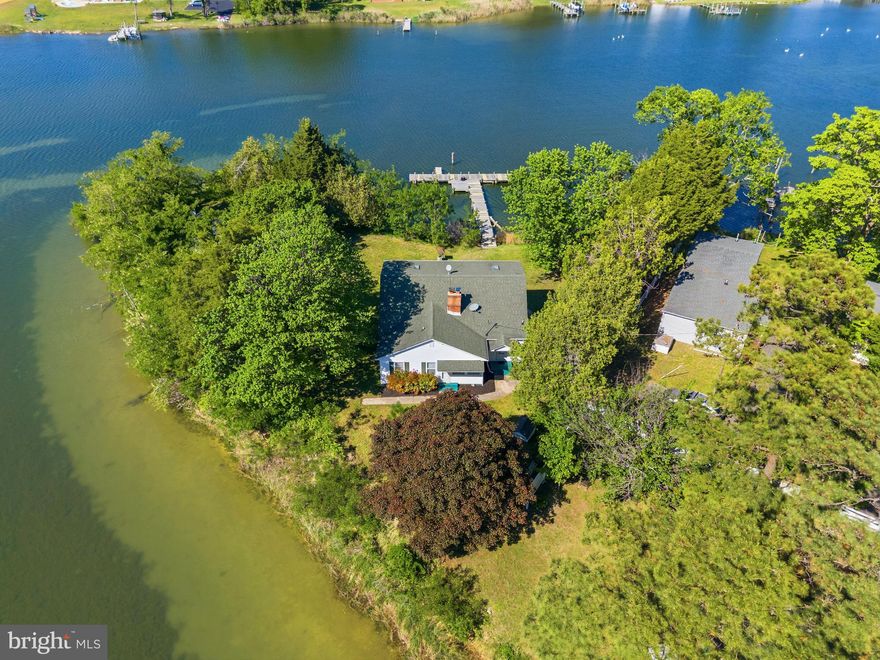 Welcome Home to Colton's Point! Experience the rare beauty of true waterfront living at this exceptional point property, where panoramic water views surround you and create a breathtaking backdrop from nearly every room. Set on a private peninsula-like setting, this spacious 5 bedroom, 2.5  three-bath residence offers an unparalleled opportunity to own a serene retreat with endless potential.

Designed for those who appreciate the water, the property features a private pier with electric—perfect for boating, fishing, crabbing, or simply enjoying life on the shoreline. From sunrise over the water to spectacular evening sunsets, every day feels like a getaway.

Inside, the home offers generous living spaces ideal for both everyday living and entertaining. The main level features beautiful hardwood floors,  formal living and dining rooms, 3BD, 1.5 BA and sunroom. Upstairs features 2BD, 1BA and a sitting room looking onto the upper deck. This home presents the perfect opportunity to personalize and create your dream waterfront escape.

Whether you're seeking a full-time residence, a weekend retreat, or an investment in an extraordinary waterfront setting, this property delivers an unmatched lifestyle. Relax on the expansive deck, host unforgettable gatherings, or simply take in the peaceful beauty that surrounds you. Waterfront opportunities like this are truly rare. Schedule your tour today!