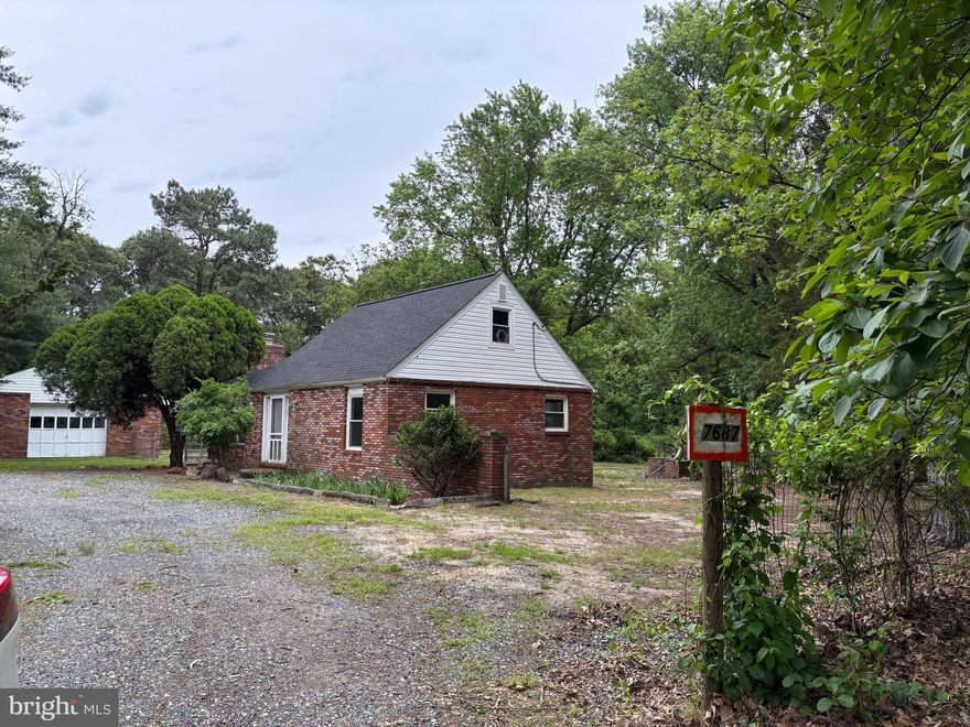 Tucked way back in the woods off private dirt road.  Ready to move in!  Cape cod with  living room, dining room/kitchen combo, 3 bedrooms, 1 bathroom, loft area, and screened porch.  Freshly painted and new flooring.  Sorry no pets with this one.  Easy commute to Route 100 to DMV area.  Close to restaurants and shopping, casino, movies at Arundel Mills.