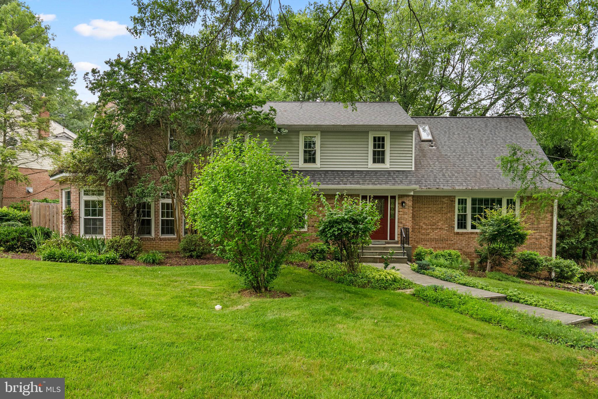 A home with rare distinguishing features in Potomac that include an
English Conservatory; all Season sunroom; custom crafted deck; stunning
new primary bath; 20 kVA Automatic Generator.
In a sought-after location with quick access to major Highways, Bethesda and Rockville
Cafes and Restaurants, Hospitals, Doctors’ office, and Shopping areas such as
Montgomery Mall. Close proximity to Potomac Woods Swim Club, Park Elementary, Hadley’s
Park, and a network of scenic walking and biking trails.
This gorgeous corner-lot stands out among its neighbors. The expansive lawn wraps
around the front and side yards framed by lush plantings and a decorative fence.
Previously a Model home, built on a half-acre lot showcases lovely landscaping
including Japanese arbors and pergolas, Japanese red maples, Rose patches and
much more. Meandering pathways lead through a series of garden vignettes, open
green space for children to play, and to a charming patio with a pergola. The one of a
kind three-tier deck built around a mature oak tree sits gracefully in the rear of the
house surrounded by flaming Azalea bushes, a Bodhi tree, built-in bench, and many
peaceful spots to relax and entertain while overlooking the beautifully landscaped rear
garden. The deck was architecturally designed and constructed with hand carved
hardwood. Comfortably shaded by mature oak trees, it sits next to a large custom
designed climate-controlled sunroom with wall-to-wall glass doors by Anderson and
many skylights. This room can be fully opened seasonally like a screened porch for
fresh breeze to flow in. Among all the existing beauty in the rear yard there is plenty of
open space to add a play area and other special features and make it your own. There
is a gate leading to the driveway in addition to a storage shed and additional
parking area.
This home has been twice renovated and expanded by the current owners. The main
level features expansive picture windows in the living and dining rooms. The two-story
addition to the house created a sun-drenched all-glass English Conservatory adjacent
to the living room overlooking the beautiful front yard with its own gas fireplace for the
winter. It can be used as a home office as well, quite a unique addition to the house.
The large family room with its wood burning fireplace along with an adjacent inner foyer
flows into the newly built Sunroom though large glass French Doors. The adjoining
Kitchen, with its own dinette area, opens to the rear deck as well through glass doors
and window giving it a panoramic view of the rear yard and the custom deck. This adds
to the theme of connecting the indoor and outdoor spaces around which house was
designed. The kitchen was just renovated and has white solid wood custom cabinetry, modern pantry and built-in desk, contemporary quartz countertops,
custom backsplash, and upgraded appliances. A stylish powder room and
laundry/storage closet completes the main level.
Upstairs is the luxurious primary suite, and three additional bedrooms, with
two full bathrooms that have also been renovated and modernized. The new spa-like
Primary Bath is beautifully finished in natural stone with a large double vanity and
tons of storage, a custom frameless glass-enclosed shower, and an oversized jetted
Jacuzzi bathtub. This bathroom expansion allowed the primary suite to be reconfigured adding additional new dressing/closet areas. The three spacious bedrooms and two updated
full baths are a huge bonus.The fully finished lower level includes a recreation room and bonus room used as a guest suite or second office cum library. You’ll also find a mudroom
with access to the oversized two-car garage, a cedar closet, and many additional
storage closets. The two and half size garage has been renovated and fitted with
wooden wall to wall cabinetry. Both the roof and the siding were replaced in 2018 and generator with auto switching added to provide uninterrupted power supply in the event of a power failure.