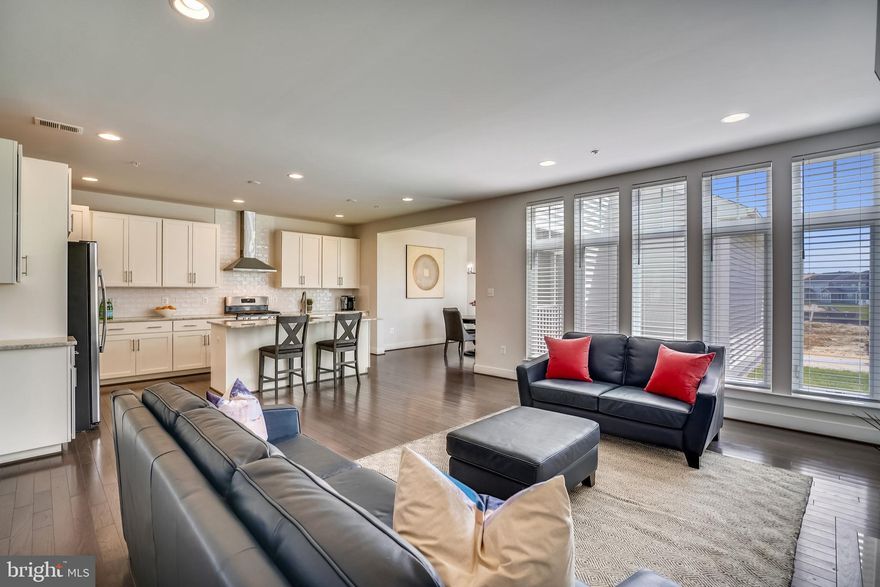 Featured in The Baltimore Sun's Hottest Properties column! Even better than new construction, this Michael Harris Homes 2018 build has been improved upon with the addition of built-in bookshelves, plantation style shutters, custom blinds, additional landscaping, and California Closets systems throughout. And it's available NOW. No waiting lists or construction delays.  ALL ages welcome.   This home is located just a minute away from the extensive community amenities - the pool, indoor and outdoor sport courts, dog park, fitness center, clubhouse, playground and plenty of green space. The Two Rivers lifestyle is unparalleled in AA Co. and it's waiting for you!   The main floor features a den or office, a formal dining room with butler area, an open kitchen - breakfast room - living room area with fireplace, a mudroom and a half bath. Two car garage. The upper floor includes a huge main bedroom with custom closet system, and a bath oasis including a stand-up shower, soaking tub, double vanity, and private WC. Three more bedrooms, a convenient laundry room, and full bathroom round out the upper level. The basement is mostly finished as a rec room, but also includes two additional roughed in rooms, which could be finished for more bedroom space. A full bath is located on this level also.