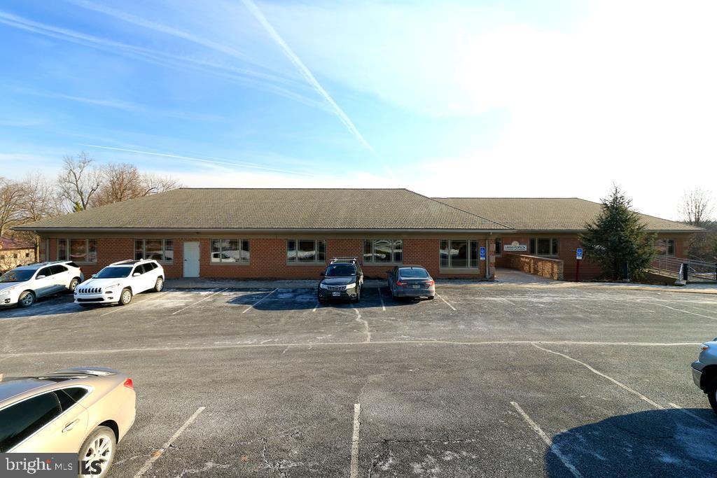 Yearning for space? Look no further! This commercial property consist of 2 units and completes the entire main floor of the building. The right unit is currently rented through 2025 by Urish Popeck. This unit consists of 8 enclosed offices, a large conference room, copy area and is equipped with a his and hers bathrooms as well as a utility room with a full shower. The unit on the left is vacant and can be slightly altered upon request. This unit offers 5 enclosed offices, a large common space equipped with several cubicles, kitchenette with attached break room, his and hers bathroom and a utility room with full shower. Minutes from N Atherton and major shopping making this an ideally located office space!
