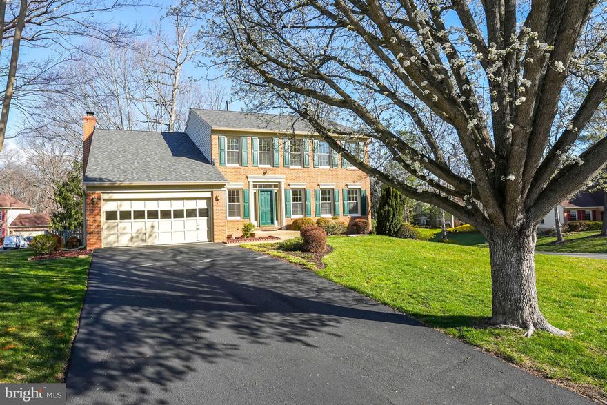 OPEN HOUSE SUNDAY, 3/30 1-3PM! This beautifully maintained 4-bedroom, 3.5-bath move-in ready single-family home with a 2-car garage is nestled in the highly sought-after Old Bridge Estates community. Boasting over 3,500 sq. ft. of living space on a spacious 1/3-acre lot, this home offers comfort, style, and convenience.  The main level features a bright, welcoming foyer with hardwood flooring, a formal living and dining room, and a spacious family room with a gas fireplace that flows seamlessly into the large, sun-filled kitchen with an eat-in area. Step outside onto the expansive entertaining deck with stairs to the back yard.  Upstairs, the primary suite impresses with a vaulted ceiling, large walk-in closet plus a second spacious closet and an en-suite bath featuring a soaking tub and separate shower. Three additional spacious bedrooms share a full hall bath.  The fully finished walk-out lower level includes a full bath, a large recreation area, laundry room and ample storage space with room for a workshop.  Outside enjoy the Deck , fenced-in back yard and in-ground sprinkler system.  Recent upgrades include a NEW roof (2025), NEW LVP kitchen flooring (2025), NEW paint on main and upper level (2025), NEW water heater (2024), Deck refinished (2024),  AC  (2020), Humidifier (2019), Replacement Windows (2011).   Located near shopping, dining, and recreation—including walking trails, swimming pool, tennis courts, and Lake Ridge—this home offers easy access to I-95, Potomac Mills, Stonebridge, Fort Belvoir, and Quantico.