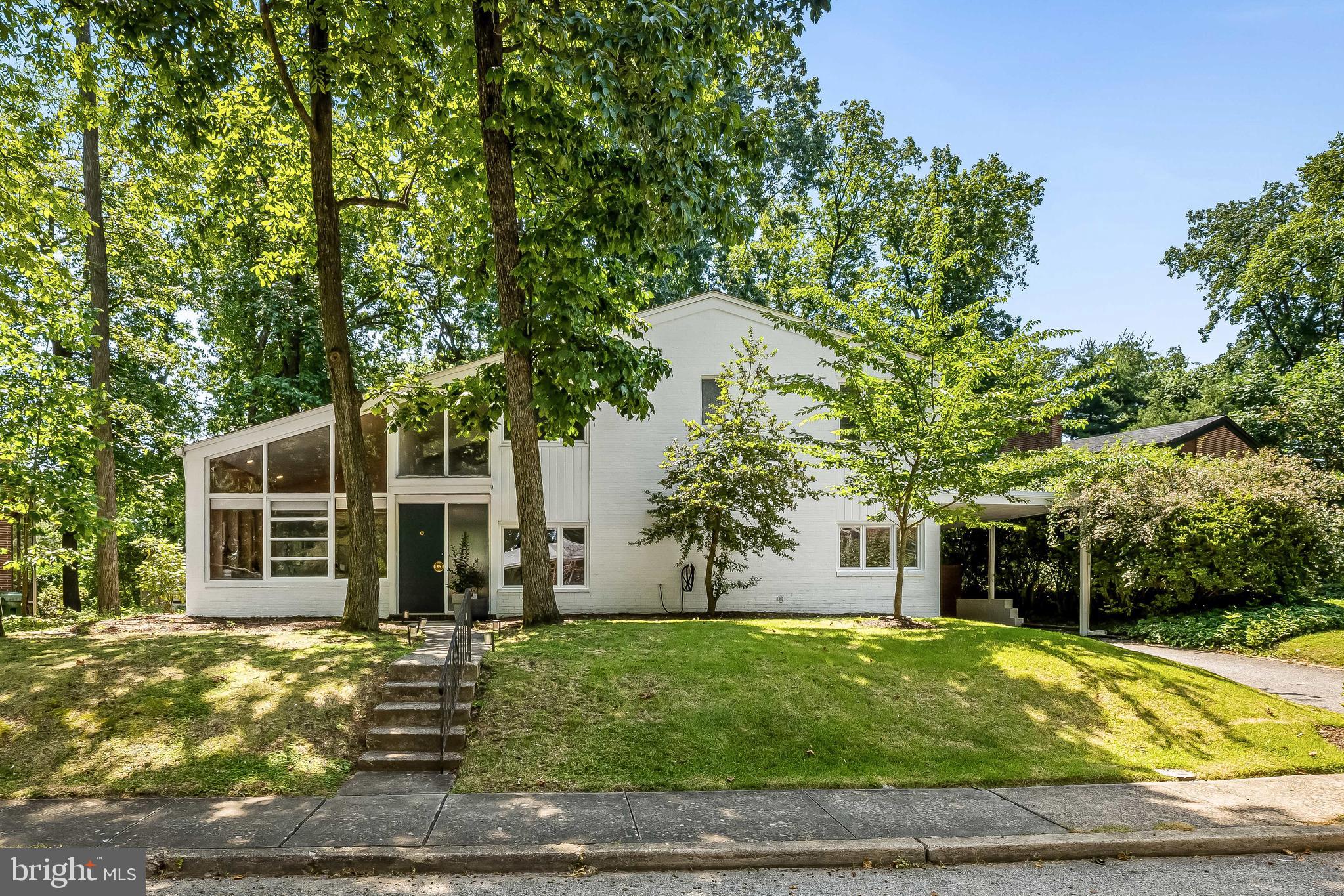 2103 Northcliff is a carefully and lovingly enhanced mid-century modern home. Renovated to be incredibly user-friendly with an open eat in kitchen, large island and an abundance of cabinetry and storage * separate adjacent laundry room, which leads to additional storage. Powder room * large entry hall * study/dining room or library with built-ins * expansive living room that spans the entire length of the home with double height ceilings and a focal brick fireplace * spacious sunroom/playroom which leads to level fenced backyard * dog run * three spacious bedrooms * refinished bathrooms to include vintage pink bathroom preserved in excellent condition * driveway, carport with sliding door * inside and outside of this fine home works so well together. A true architectural MCM Gem! Enjoy!