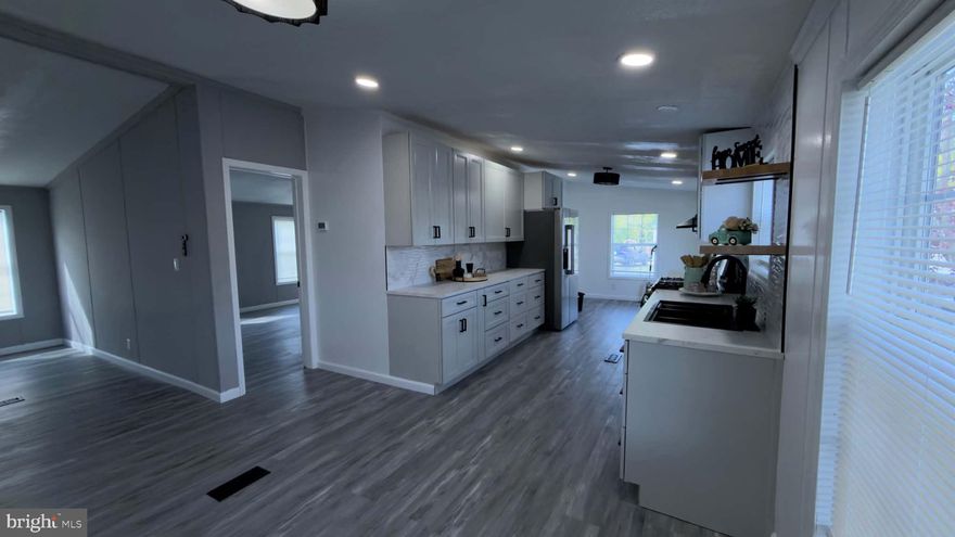 This remarkable double-wide home located in Swan Harbor Dell offers 3 bedrooms and 2 full bathrooms with stylish updates throughout. Featuring all-new flooring, appliances, kitchen counters, cabinets, and beautifully renovated bathrooms, this home is truly move-in ready. Enjoy modern finishes including quartz shower walls and a stunning electric fireplace with a quartz accent wall.

Outside, you’ll find a convenient storage shed and a side deck with a roof covering overhead — perfect for relaxing outdoors.

Don’t miss your chance to own this updated home — schedule your showing today!

Lot rent is $733/month and includes water, sewer, and trash (buyers should verify with park management). All buyers must be approved by the park.
