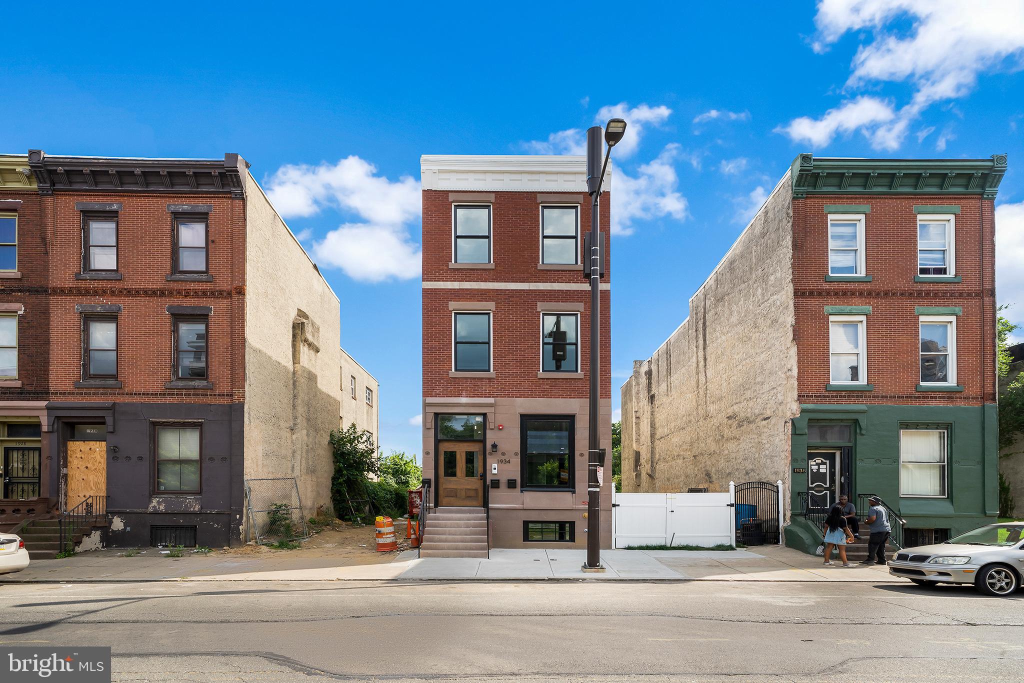 Lucrative investment opportunity! Discover this newly built triplex, steps from Temple University, offering a unique blend of history and modernity. The property boasts three expansive units, with the 1st-floor featuring 5 bedrooms plus a den, while the 2nd and 3rd floors each offer 3 bedrooms and 2 bathrooms. Its stylish exterior seamlessly integrates into a neighborhood rich with both new construction and historic buildings. Every unit has been meticulously designed with premium finishes, high ceilings, and thoughtful craftsmanship throughout. Located just blocks from Broad Street, you're minutes away from public transportation, dining, shopping, and entertainment. This is an investment built to perform year after year in the ever-growing Temple University area. Don't miss your chance to own a high-performing, income-generating property!