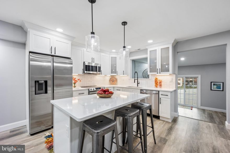 Wow, Completely redone 3 bedroom 2.5 Bath Townhome with Family room with Fireplace & Cathedral ceiling. Plus full finished basement with new flooring, ceiling with LED lighting and custom wet bar. Top of line Kitchen includes Custom White cabinets with soft close drawers, Glass doors and deep stainless sink. Island with drwarers and breakfast bar. Must see custom Quatz Countertop with marble backsplash.  Kitchen has ungraded Samsung stainless appliances including build in mircowave & dishwasher.  Custom oven with glass top range. Opening above sink overlooks huge family room with cathedral ceiling and large corner fireplace. Kitchen has breakfast bar and plenty of room for kitchen table plus dining area.  Stepdown to large living room or stepdown to huge family room. Great design. All new vinyl plank waterproof flooring and Led lighting thoughtout. Few stairs down to remodeled powder room then continue down to full finished basement. Den or playroom in front with didivider wall that opens to large Recreation room that features a custom built wet bar that will be the highlight of all your gatherings. 
Custom stairs from living room to large 2nd level. Large master bedroom with oversized double closet. Primary bath has beautiful double shower with custom full glass door and easy walk in shower floor. Large custom double vanity and linden closet. Completely new full bath in hallway with tub shower.  2 other good size bedrooms with double closets. New windows and doors throughout including slider on back of family room that leads to rear patio. This is the nicest townhome onthe market. Hurry.