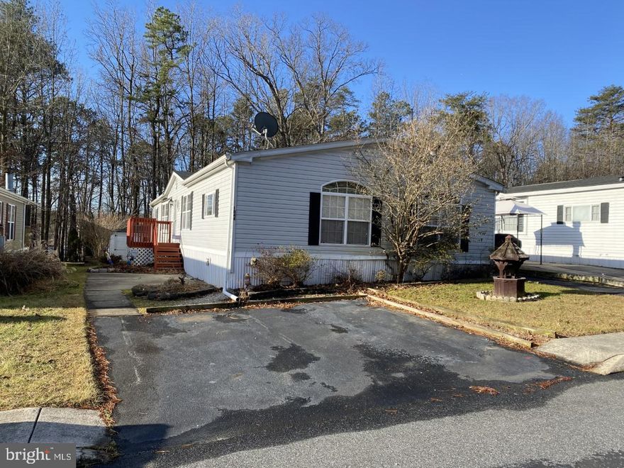 Charming 3BR, 2BA manufactured home on quiet street, backing to trees. This open-concept property features spacious kitchen with island, open to both the dedicated dining space, as well as the cozy Family Room with fireplace and built-ins. Primary Bedroom with extra-large walk in closet and attached bath with garden tub, stall shower & skylight. Shed on property is included. This neighborhood has a community pool, playground, and clubhouse. New Roof in 2021 (25 year shingle) Water Heater 2019, HVAC 2016 (4-ton unit, 10 yr comp warranty) 
LOT LEASE APPROVAL REQUIRED - GROUND RENT IS $612/MONTH
Pet Restrictions - Maximum # of dogs is 2 - Max weight per pet is 30lbs
Don't let this one get away! Make your appointment to see this charmer today!