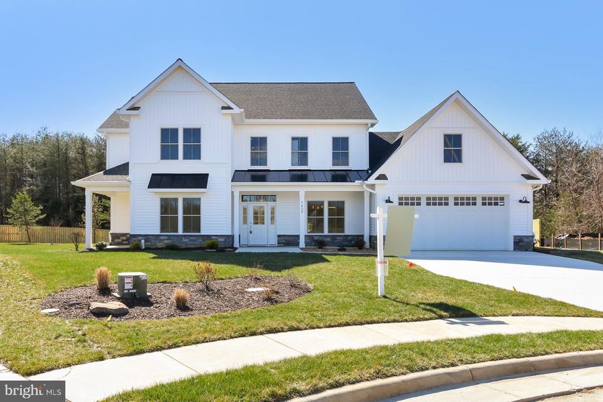 Exceptional Brand New Home on Cul de Sac lot! Backs to trees with huge backyard area. 6brs, 4.5 baths, with at least one bedroom and 1 full bath on all 3 levels. Built to offer a lifetime of easy access living-from the zero step entry to wider hallways and doors.
Expansive main level with a fabulous kitchen featuring beautiful and abundant cabinetry, walk in pantry, a huge serving island and upgraded stainless appliances. The adjacent family room and the kitchen both open to a covered rear porch, offering effortless entertaining indoors and out. The main level study has it's own private covered patio area. A main level BR and large bathroom with a beautiful frame less shower allow for those with less mobility to fully enjoy living here or visiting. Gorgeous wood floors cover 90% of the main level and you will be impressed by all of the exquisitely tiled and appointed bathrooms. Upstairs, four bedrooms and THE LAUNDRY room. The owner's suite includes his and her walk in closets and an exceptional bathroom with free standing soaking tub and over sized shower.  There is another 1500 sq feet of finished space on the lower level, with additional storage space/future room space.
Don't settle for an "in fill" NEW Home, join others who have invested in this close in location of impressive homes!