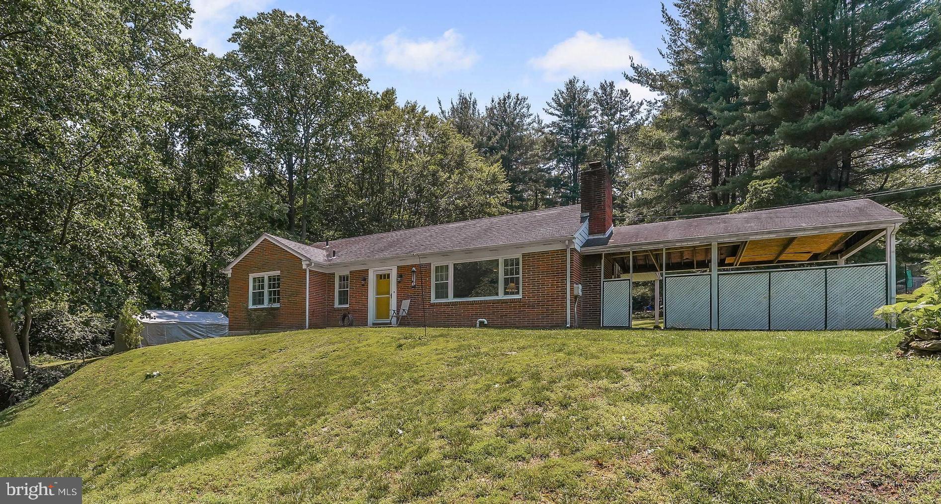 Welcome home to this conveniently located and comfortably priced brick RANCH home in award winning Rose-Tree Media School District. One Floor Living features 3 bedrooms and 1.5 baths with an adjoining carport. The lot is 1.22 acres and there is room to park many cars on the newly sealed driveway. The kitchen has been updated with newer cabinets, a brand new stainless steel stove, a brand new built-in stainless steel microwave, recessed lighting, tile floor and tile back-splash, dishwasher, and granite counters. Its an eat-in kitchen with a back door leading to a nice sized concrete back patio. The focal point of the living room is a beautiful brick over-sized fireplace with a new mantel and gas logs. A big picture window also accents the living room. Off the living room, find a dining room area that leads to the side door and attached carport. There are hardwood floors throughout the home. Down the hall find the updated full bath with tub surround, wainscoting, and hexagon tile floor. The master bedroom features hardwood floors, and an attached half bath. Two other bedrooms complete the floor plan. Additional updates include central air installed in May 2021, newer landscaping , replacement windows, recent electrical updates, and a new hot water tank in 2024. Note there is also an outside water drainage system to keep any water away from the house. The unfinished basement with high ceilings is a full blueprint of the first floor and includes a walk out door. The space is enormous - imagine all the possibilities here like additional living space, bedrooms, additional bath, or work space. Plenty of room to grow and expand! A private outdoor front space with a small stream and a nice sized back yard provide room for all kinds of outdoor activities, nature exploration, and gardening possibilities. Located only a few minutes drive from the hustle and bustle of Media Boro plus very close to shopping, transportation, schools, and parks like Rose Tree Park and Ridley Creek State Park. So stop the car at the red mailbox ....... and make your appointment today!