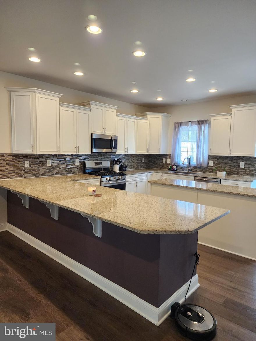 Luxury living at its finest! This oversized 4 level townhouse rental has everything you could want and more. The beautiful open kitchen, complete with a butler's pantry, granite countertops, and stainless steel appliances leads out to a deck off the rear of the house where you can enjoy your morning coffee or evening cocktail. The main level also features a large open living room with a remote electric fireplace that changes colors for enjoyable ambiance. With an attached 2 car garage that enters the basement leading out to a fenced backyard with turf for easy care, this home is perfect for those who love both indoor and outdoor living. Upstairs boasts three bedrooms and two full bathrooms plus laundry on the bedroom level - making it convenient for all members of your household. Additionally, there's even a fourth level which can be used as an office or movie room - the possibilities are endless! Close proximity to shopping, restaurants, and commuter routes make this location ideal for any lifestyle. Don't miss out on this amazing opportunity! New photos coming soon so stay tuned!