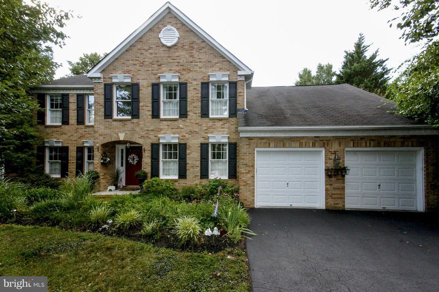 Classic Brick Front Colonial with Many Updates. Open Kitchen Area Features Granite Counters, Breakfast Bar, Built-in Workstation.  Kitchen Overlooks Step Down Family Room with Two Story Vaulted Ceiling, Skylights, Floor to Ceiling Stone Hearth. 2nd Floor New Carpets. Rec and Game Room in Lower Level with Walkout to Rear Yard. Newer A/C, HW Heater. Rare CuldeSac Location. Serene, Park Like Setting.