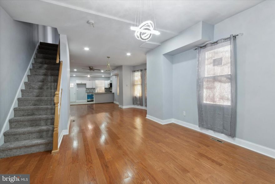 Exquisite 4 BR 3 Baths Twin corner home.  Lots of space and land. This includes a 2 car detached rear garage. front lawn, open front porch, Enter Living room to the open floor plan recently complete rehab. Beautiful floors, recessed lighting, and handing lights. formal dining room, Open kitchen with island and all SS appliances. totally redone basement with a 4th bedroom or work room, full bath in basement. (New central heat and A/C to be added), 100 amp services, 2nd fl has master br and full master bath, 2 other bedrooms and full hall bath. tastefully done.  Easy to show and ready to go.