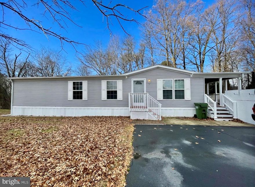 Wonderful home in Maybell Manor.  2/3 Bedrooms with 2 Full Baths.  Features Include: BEAUTIFUL eat in kitchen - HUGE Owner's suite with walk in closet and separate tub & shower - Ceiling fans - Separate laundry room - LARGE Covered side deck deck with views of trees and open space - 2-3 car driveway - nicely landscaped wooded lot - Minutes to Harford County - $550 Monthly Lot Rent - Must be approved by community.