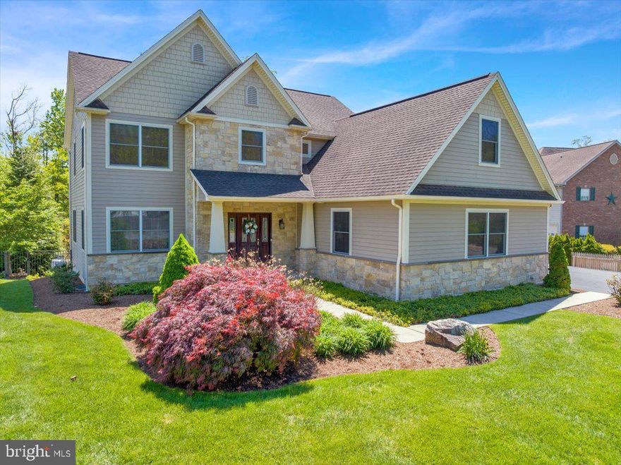 Welcome to 119 Woodview Dr.,  this exceptional, quality-built Curtis Bailey custom home is nestled on a quiet cul-de-sac in Ridgeview! One of the most sought-after neighborhoods in the prestigious Blue Mountain School District! Perfectly positioned for convenience to Route 61, this residence offers sophistication and every amenity today’s discerning buyer desires. Step through the tiled foyer into an open-concept layout adorned with stunning Brazilian cherry wood flooring throughout. The dedicated office provides a quiet workspace, while the spacious family room features a dramatic two-way gas fireplace for year-round ambiance and comfort. The gourmet kitchen has luxury finishes, showcasing granite countertops, custom cabinetry with built-in spice racks and pot-and-pan storage, soft-close drawers, and top-of-the-line stainless steel appliances. Adjacent is a mudroom with separate entrance and laundry, located just off the oversized two-car garage, providing practical everyday convenience. Entertain effortlessly with an open floor plan that flows to the dining area and onto the deck—complete with a dedicated propane line for grilling—overlooking a private, heated saltwater pool and built-in hot tub. The backyard is a private oasis and also includes a brand-new pool liner and a smart pump system you can control from your devices. Impeccably done landscape and hardscape.  Additional lower level garage-style storage keeps pool equipment organized and out of sight.  In addition, an outdoor custom built stone fireplace with paved seating area! 
Upstairs, the luxurious primary suite boasts a spacious walk-in closet and a recently remodeled ensuite bath featuring a soaking tub, double sinks, and elegant finishes. Three additional generously sized bedrooms and a fifth large bonus room over the garage offer abundant living space for family or guests.
The fully finished walkout basement is an entertainer’s dream, complete with a full bar, family room, and direct access to the pool and patio area. A full bathroom and generous storage complete the lower level.
Additional features include a water softener system, geothermal heating, cement siding and a real stone veneer.   This property has a meticulously maintained interior and exterior where no detail has been overlooked! This extraordinary home combines elegance, function, and location—truly luxury living at its finest. Easy commute to I78!  Great location!