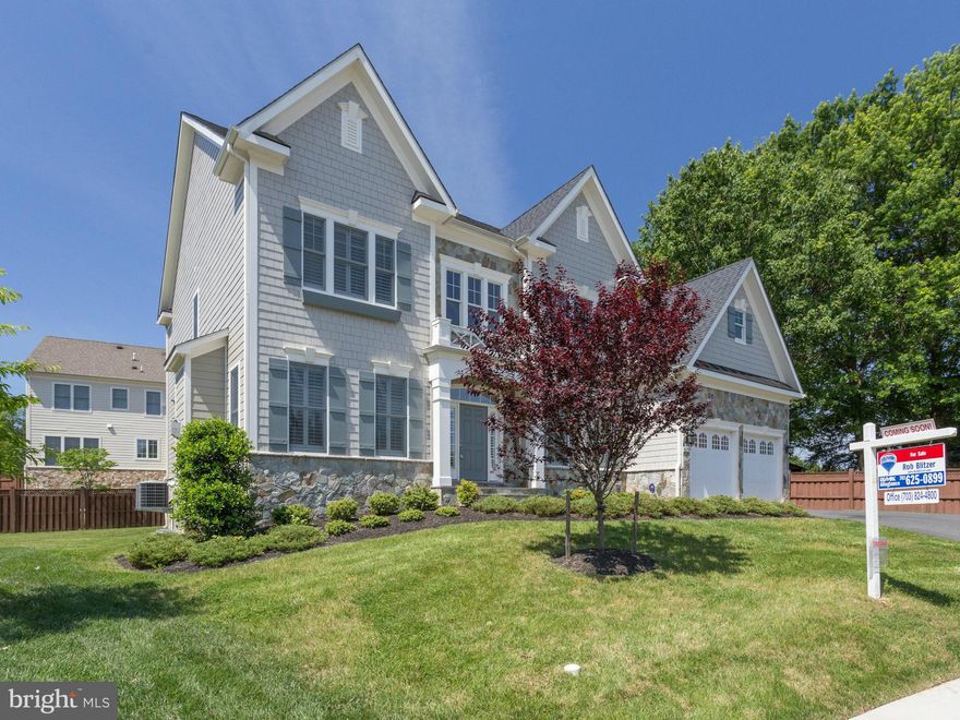 Spectacular home on a quiet cul-de-sac just minutes to DC! Large open floorplan with 5 bedrooms, 4.5 baths. The main floor has gleaming hardwood floors, welcoming open foyer and is flooded with natural light throughout. Gourmet kitchen opens to the family room and walks out to the deck and patio. Huge Master suite complete with sitting room, luxury bath & tray ceiling. Rec room with great bar area