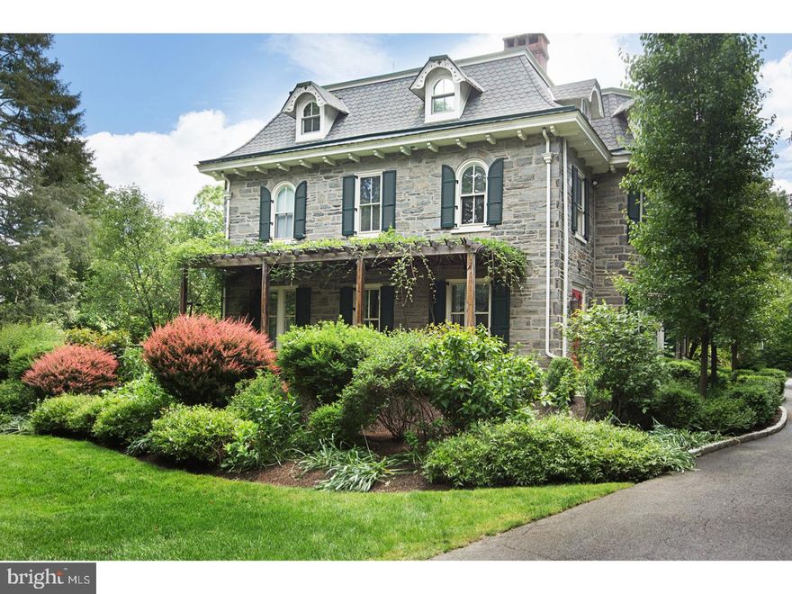 This truly special 1860 stone Victorian in desirable Wyndmoor has been lovingly renovated and expanded throughout by the current owners. It's rare to find such an exquisite and distinguished classic home with the flow and amenities of a modern property that appeals to today's buyer. Enter into the original, large, entry foyer with floor-to-ceiling windows, marble floor and fireplace, and you are immediately struck by the incredible original details and soaring ceilings. Flanked on one side by an oversized dining room with bay window, original floors and fireplace, and original double doors that open to a welcoming living room with Mercer tile surround fireplace. The family hub of the home is highlighted by the updated sun-filled chef's kitchen with 8-burner Wolf stove, lounge with homework center, expanded breakfast room and mudroom addition with slate floor and cubbies; both opening to the blue stone terrace. Family room/library with exceptional original details such as floor-to-ceiling built-ins, oversized windows, fireplace and original doors to terrace, renovated butler's pantry and updated powder room complete this incredible first floor. The second floor includes a large, updated master suite with his/hers walk in closets, wonderful frameless slate shower and double vanity, second large en suite bedroom with bay window and fireplace; two additional spacious bedrooms with fireplaces; hall bath and second floor laundry. The large, flexible third floor includes the fifth bedroom, a full gym, large media room with built-in oversized sectional for the ultimate gaming or movie experience, and two additional rooms perfect for office space, play rooms or bedrooms. The exterior is as impressive as the interior, including a front terrace with pergola, large blue stone rear terrace with custom fire pit, gas grill, surround sound and great flow into the pool area with Jacuzzi. The rear pool and terrace are surrounded by incredible mature plantings, a fenced, raised-bed vegetable garden and a spacious, flat yard that's perfect for a pick-up game of flag football or baseball. All this and more is just a short walk to the train and all the wonderful amenities of Chestnut Hill.